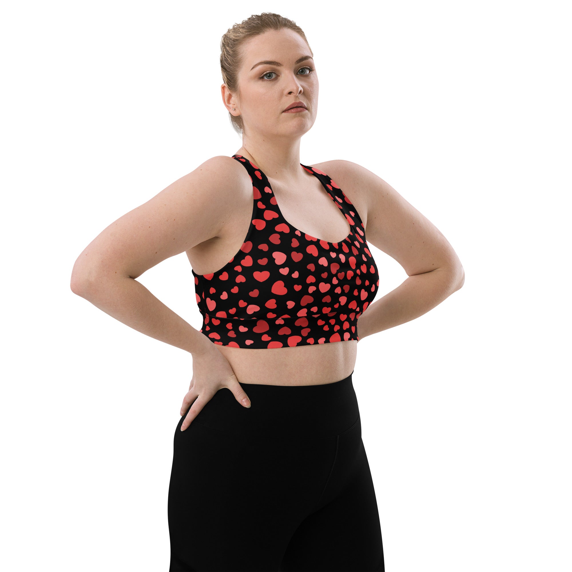 Black longline sports bra with red heart pattern buttery soft recycled fabric high intensity support and quick dry