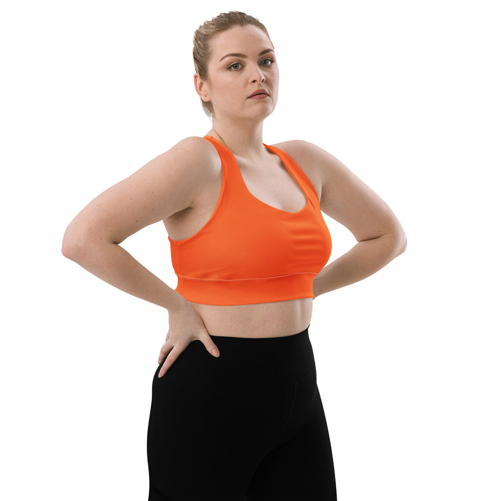Bright orange womens recycled longline sports bra with racerback seamless design for high intensity support