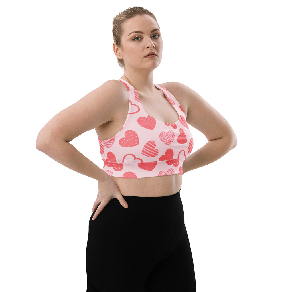 Women’s pink heart pattern buttery soft recycled longline sports bra with adjustable straps and high intensity support
