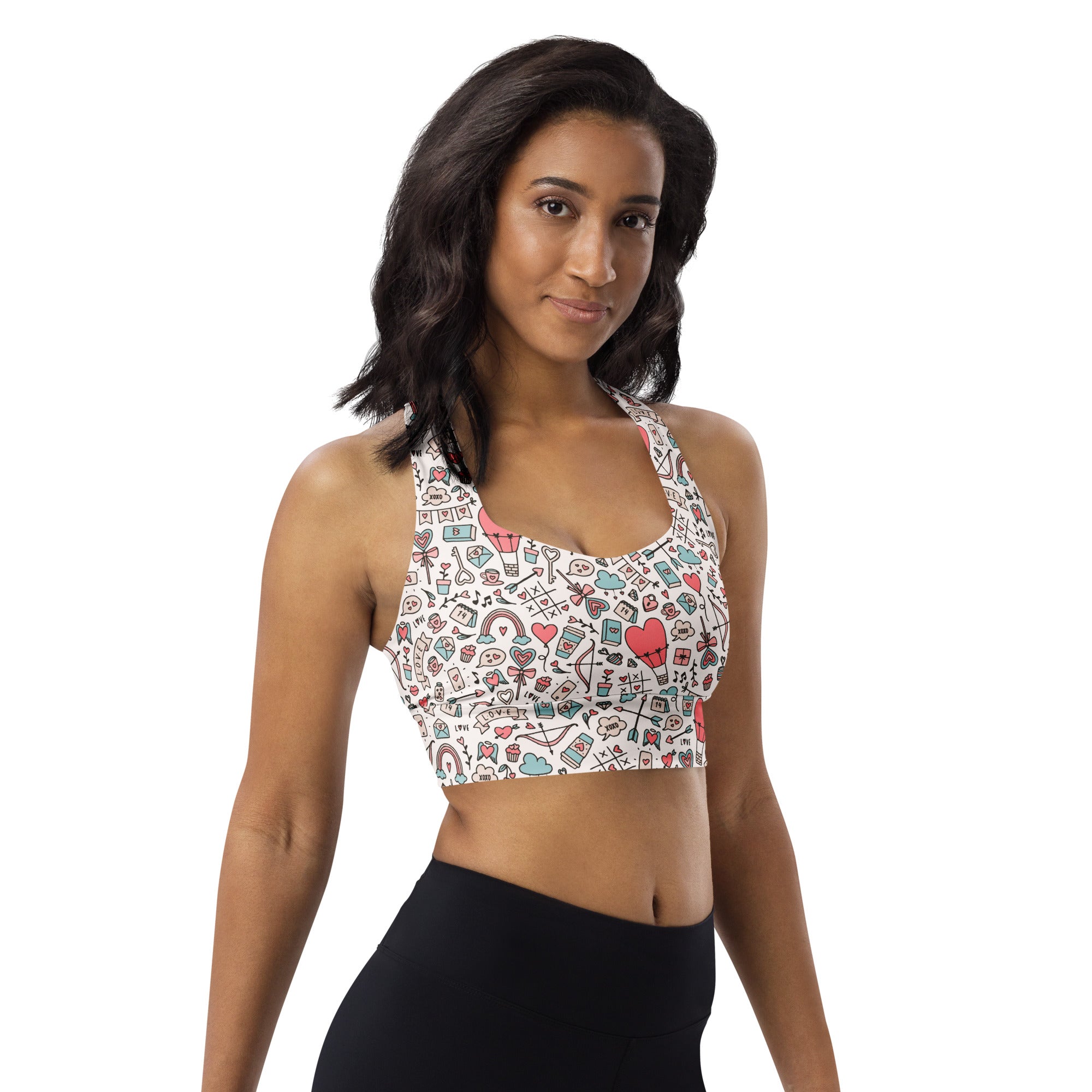 White longline sports bra with colorful doodle hearts and keys made from buttery soft recycled fabric for high intensity support