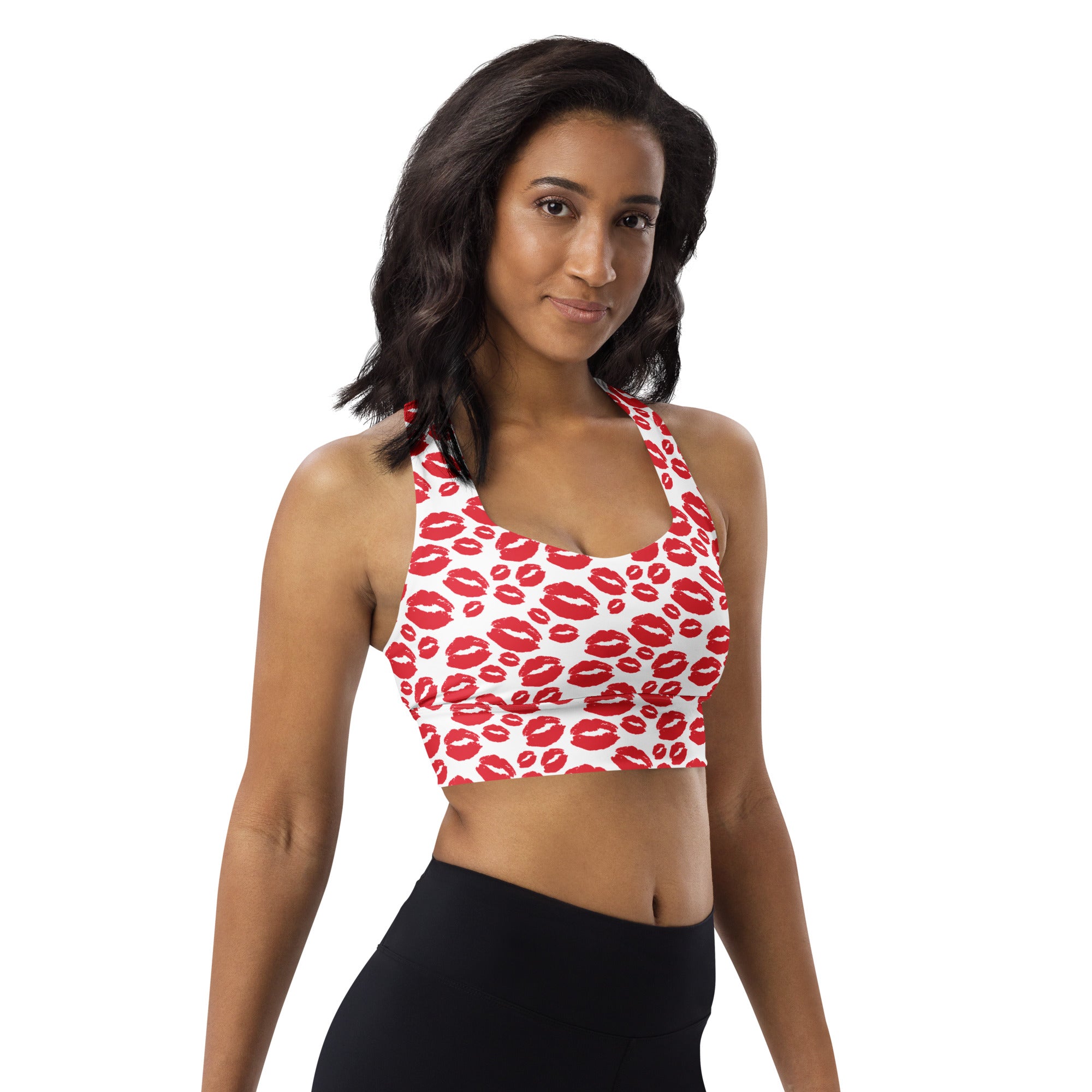 White longline sports bra with bold red lipstick kiss print made from buttery soft recycled fabric for high intensity support