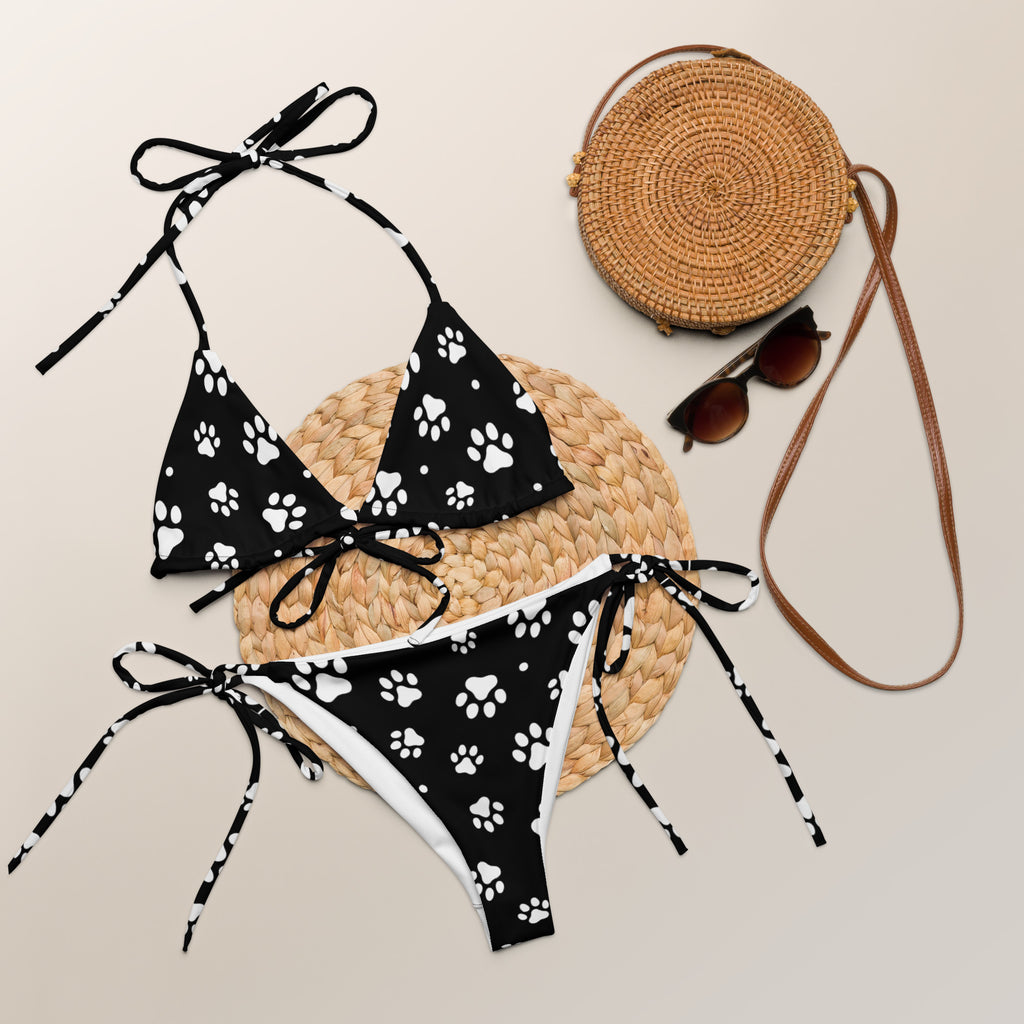 Women’s black and white paw print buttery soft recycled string bikini set with UPF 50+ and tie-side strings