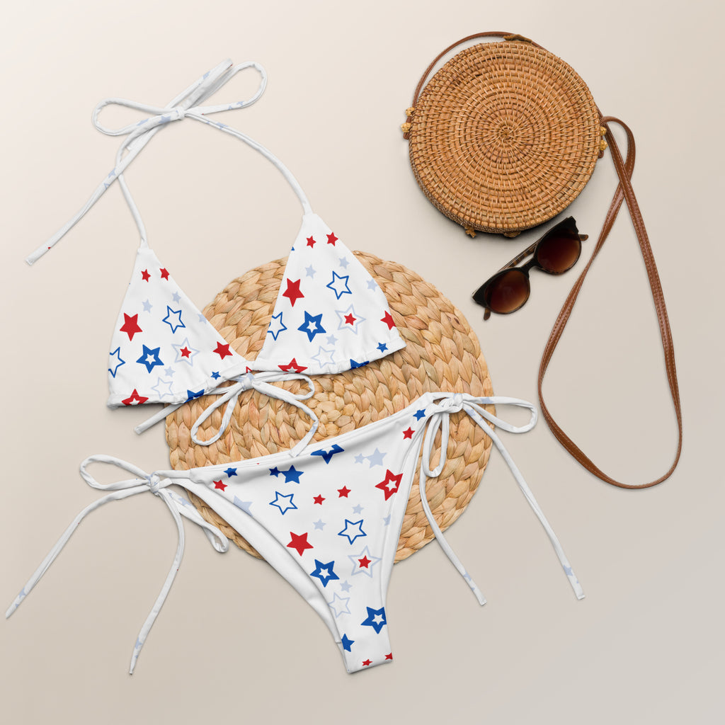 Women’s patriotic stars buttery soft recycled fabric white bikini with red and blue star patterns and white tie-side strings
