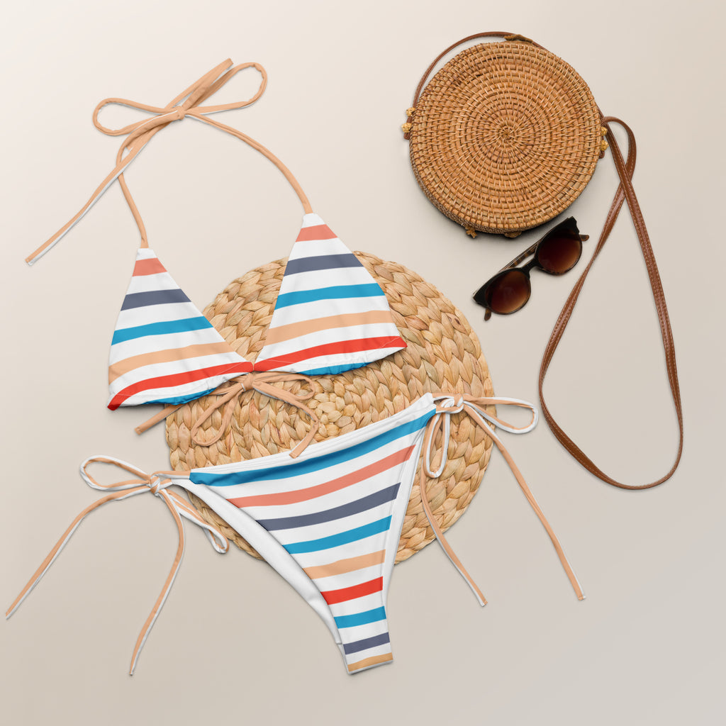 A colorful wavy stripes buttery soft recycled string bikini set with triangle top and bold red blue beige navy and white stripes