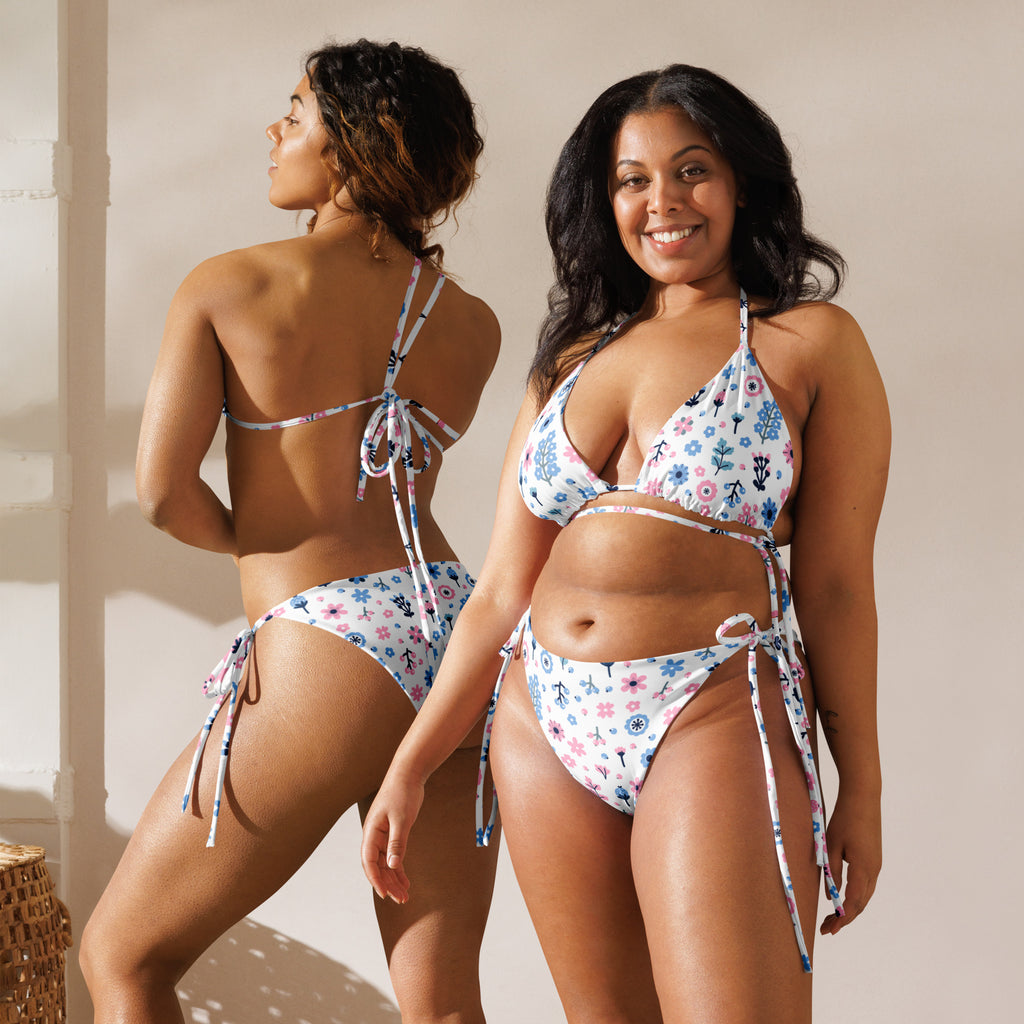 Women’s pink and purple floral soft recycled string bikini with UPF 50 plus in white with adjustable tie-side straps