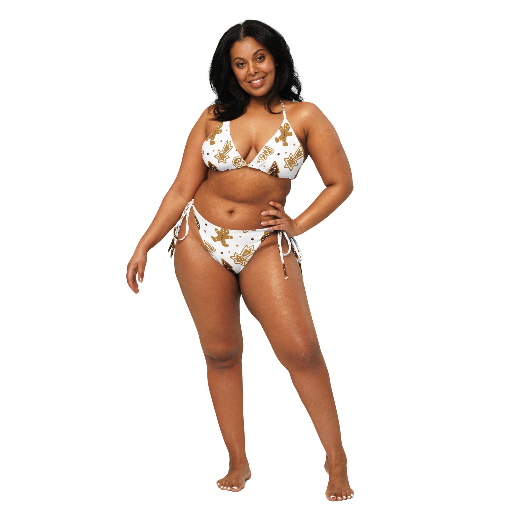 White bikini set with gold star and gingerbread man patterns featuring adjustable side ties and buttery soft recycled fabric