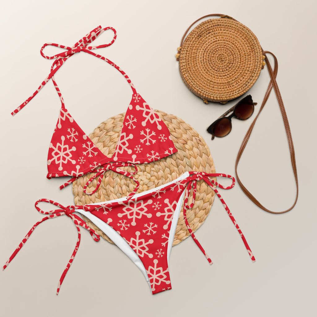 Women’s red string bikini set with white snowflake patterns buttery soft recycled fabric and UPF 50 plus protection