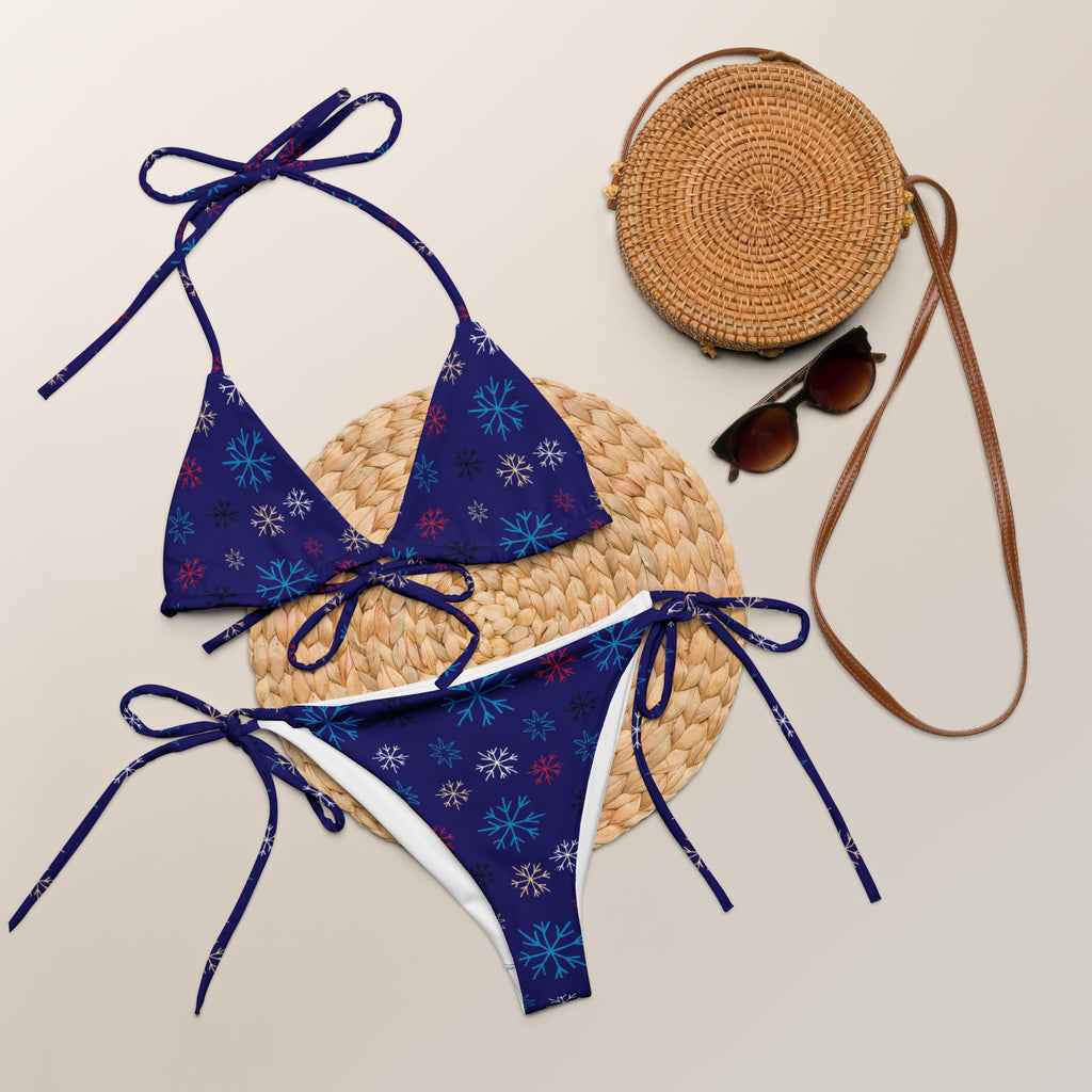 Women’s navy multicolor snowflake buttery soft recycled string bikini with upf 50 plus adjustable ties and white trim