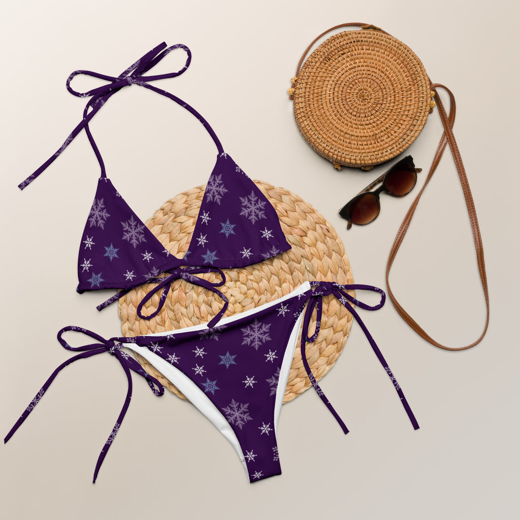 Women’s purple recycled string bikini set with white snowflake patterns buttery soft fabric and upf 50+ protection
