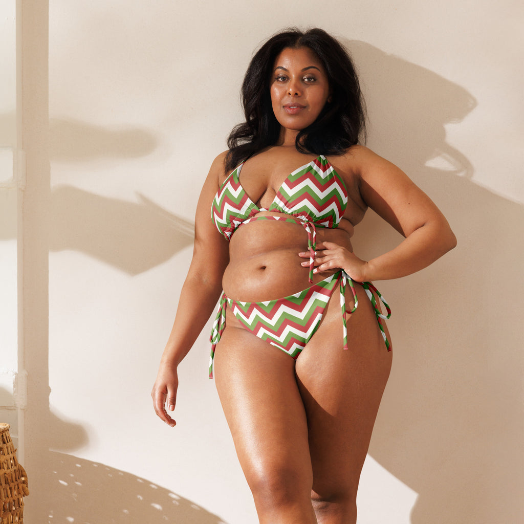 Women’s plus-size recycled string bikini in green white and red chevron stripes with adjustable side ties and upf 50+