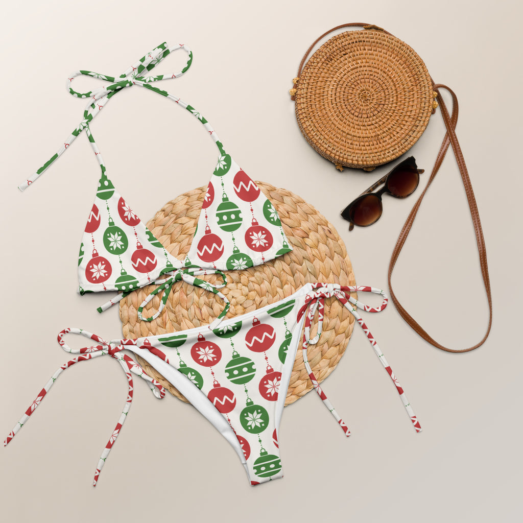 Women’s white recycled string bikini with red and green christmas ornaments buttery soft fabric and upf 50+ protection
