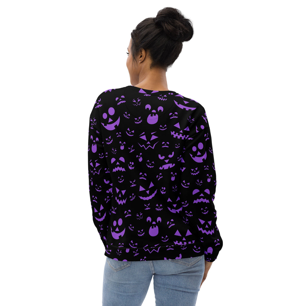 Back of a black long-sleeved sweatshirt with vibrant purple jack-o-lantern pattern and brushed inner fleece fabric