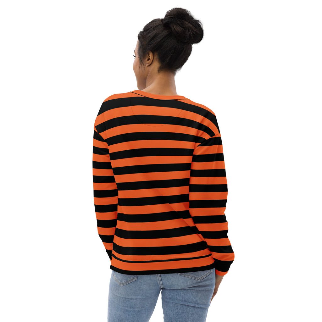 A woman wears an orange and black striped halloween sweatshirt with long sleeves and brushed inner fleece fabric