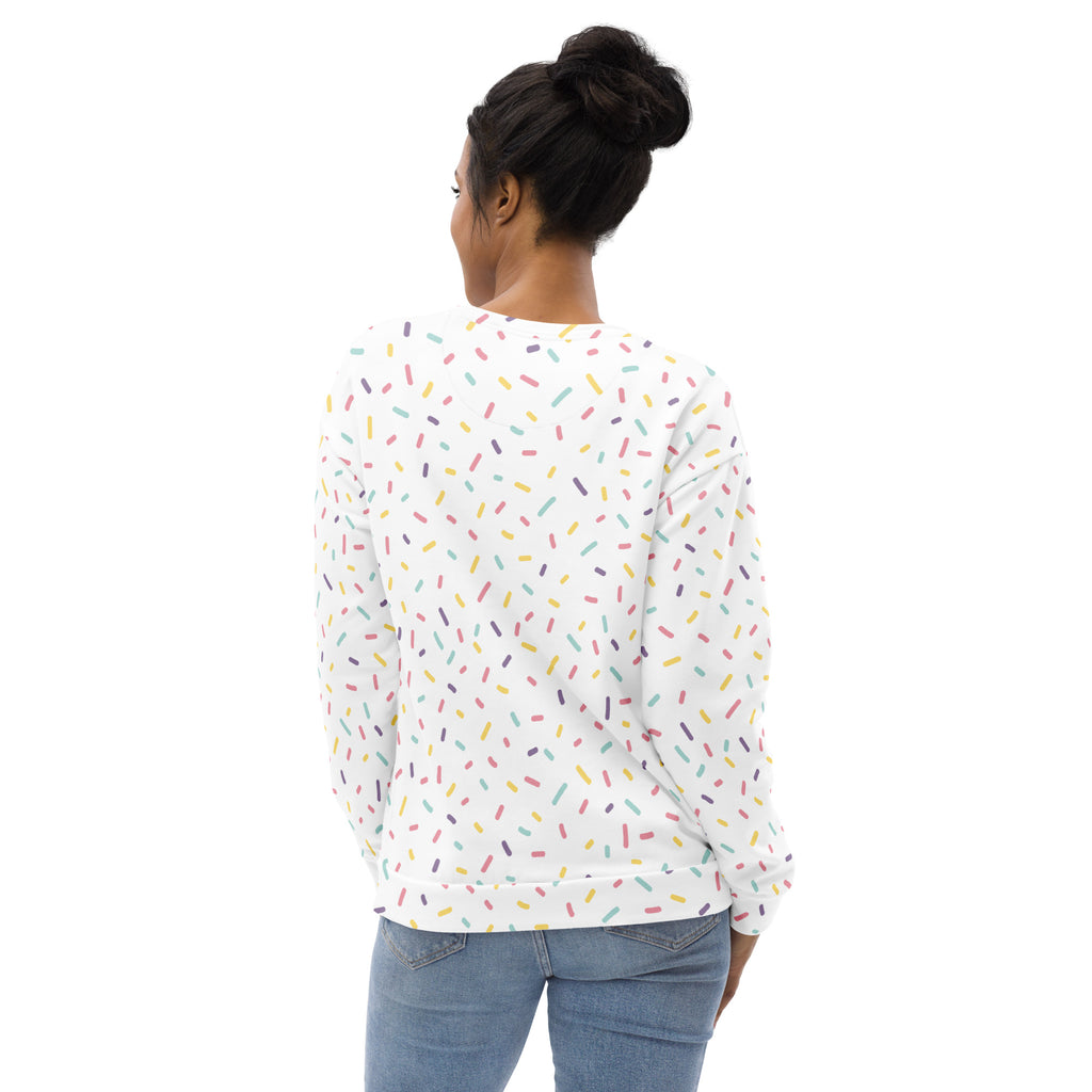 White long-sleeved sweatshirt with colorful sprinkles pattern and brushed inner fleece fabric for cozy wear
