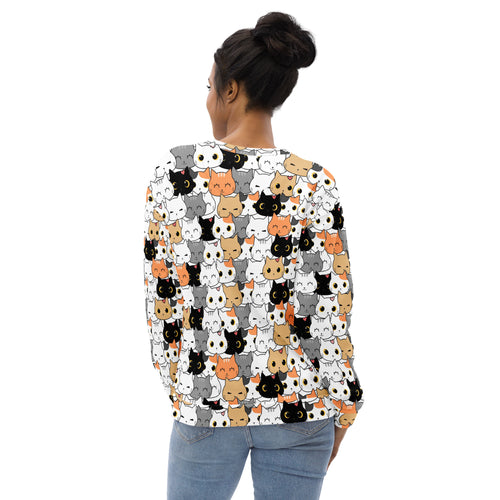 A woman wears a cat face sweatshirt with brushed fleece fabric and colorful cartoon cat print on a long-sleeved top