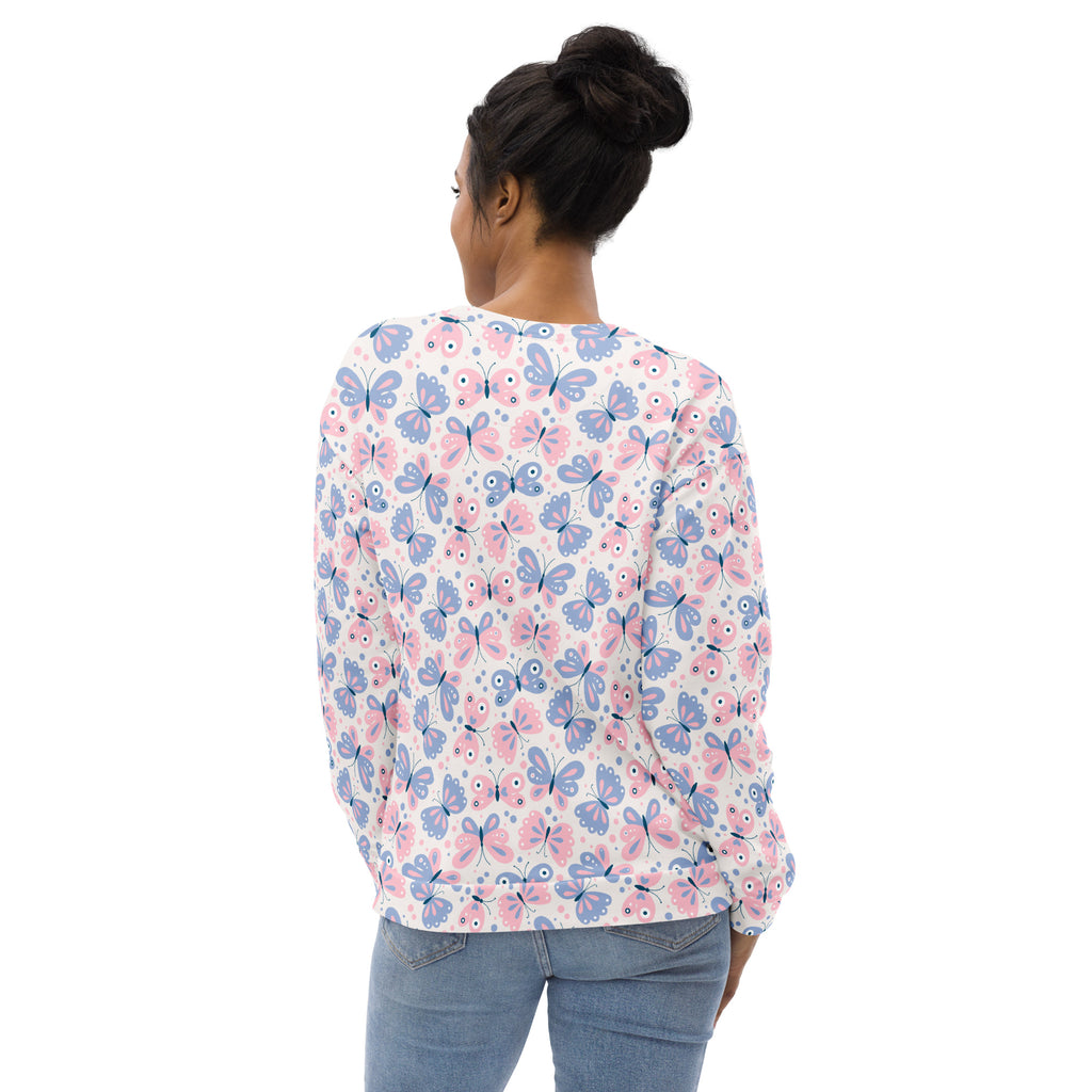 A woman wears a white pastel butterfly sweatshirt with long sleeves and brushed inner fleece fabric