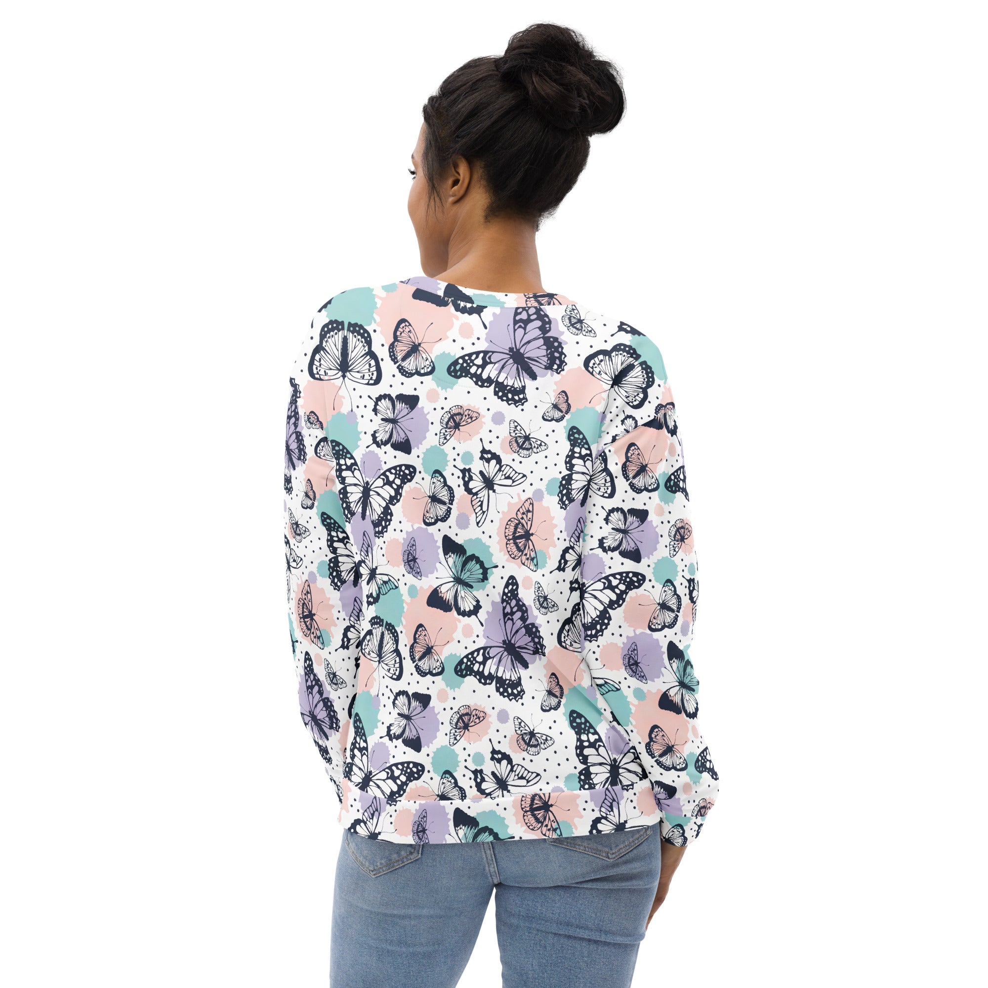 Butterfly sweatshirt with brushed inner fleece fabric featuring pastel butterfly pattern on white long-sleeve top