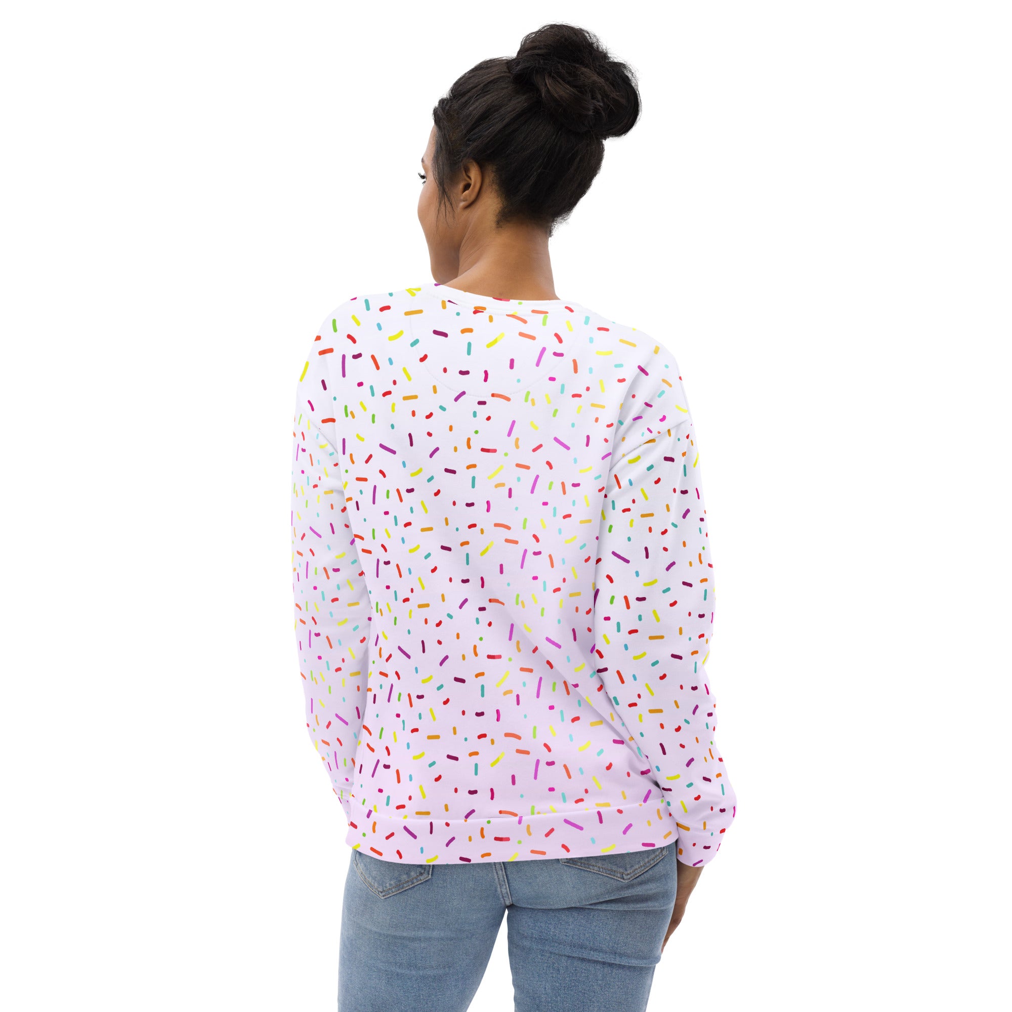 A white long-sleeved sweatshirt with multicolored sprinkles and brushed inner fleece fabric for warmth