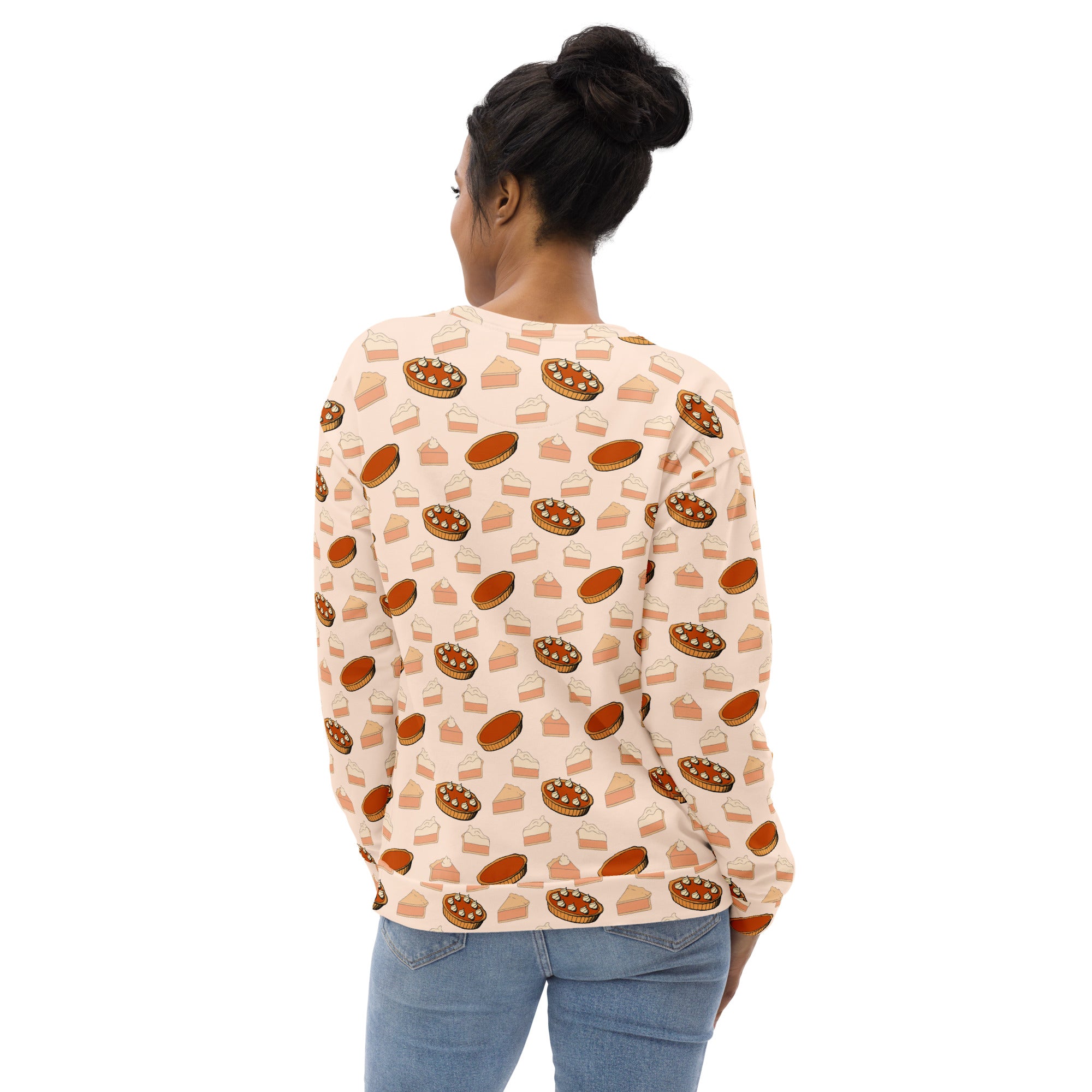 A soft peach long-sleeved pumpkin pie thanksgiving sweatshirt with brushed fleece and pie slice print