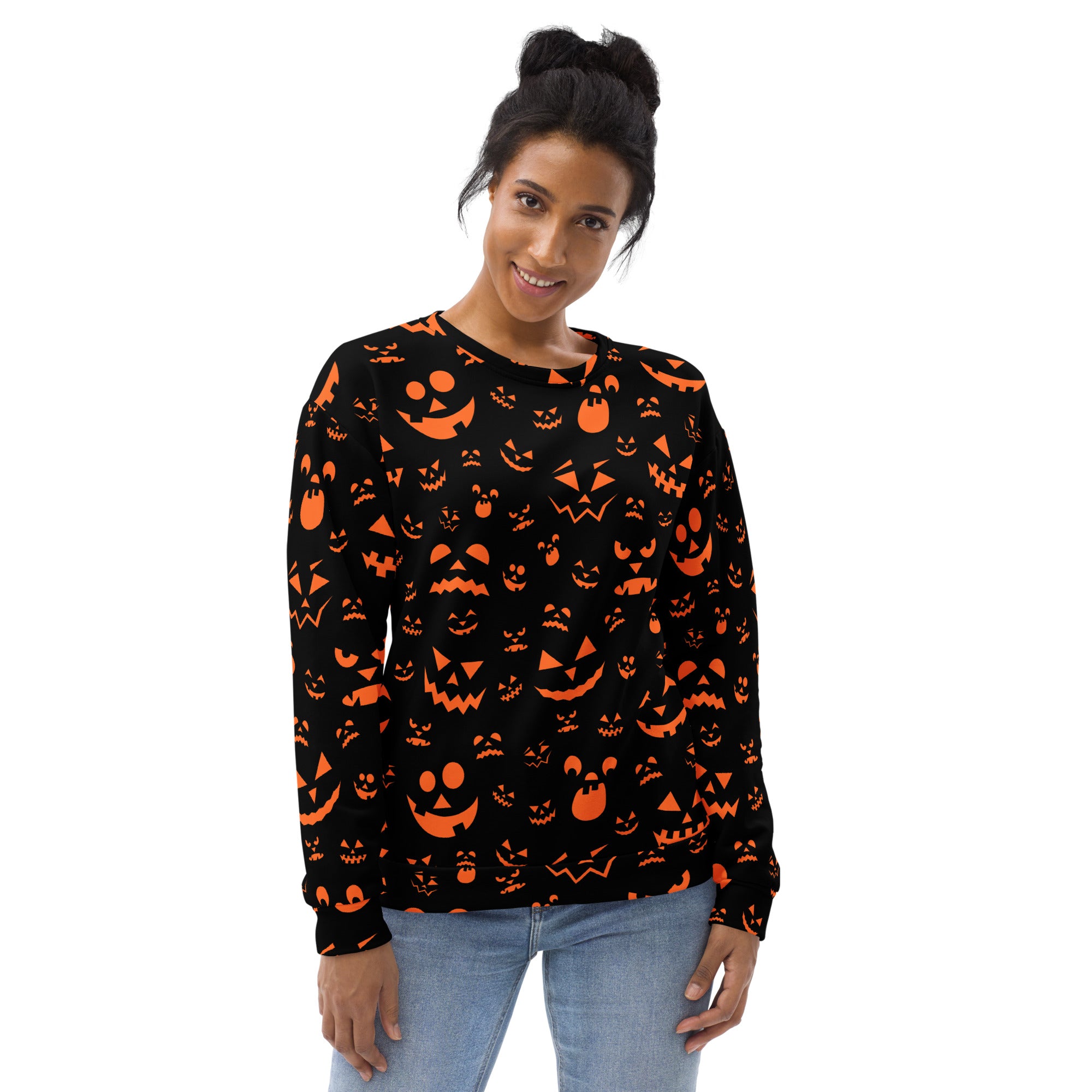 Black long-sleeved sweatshirt with orange jack o lantern faces and brushed inner fleece fabric for halloween wear