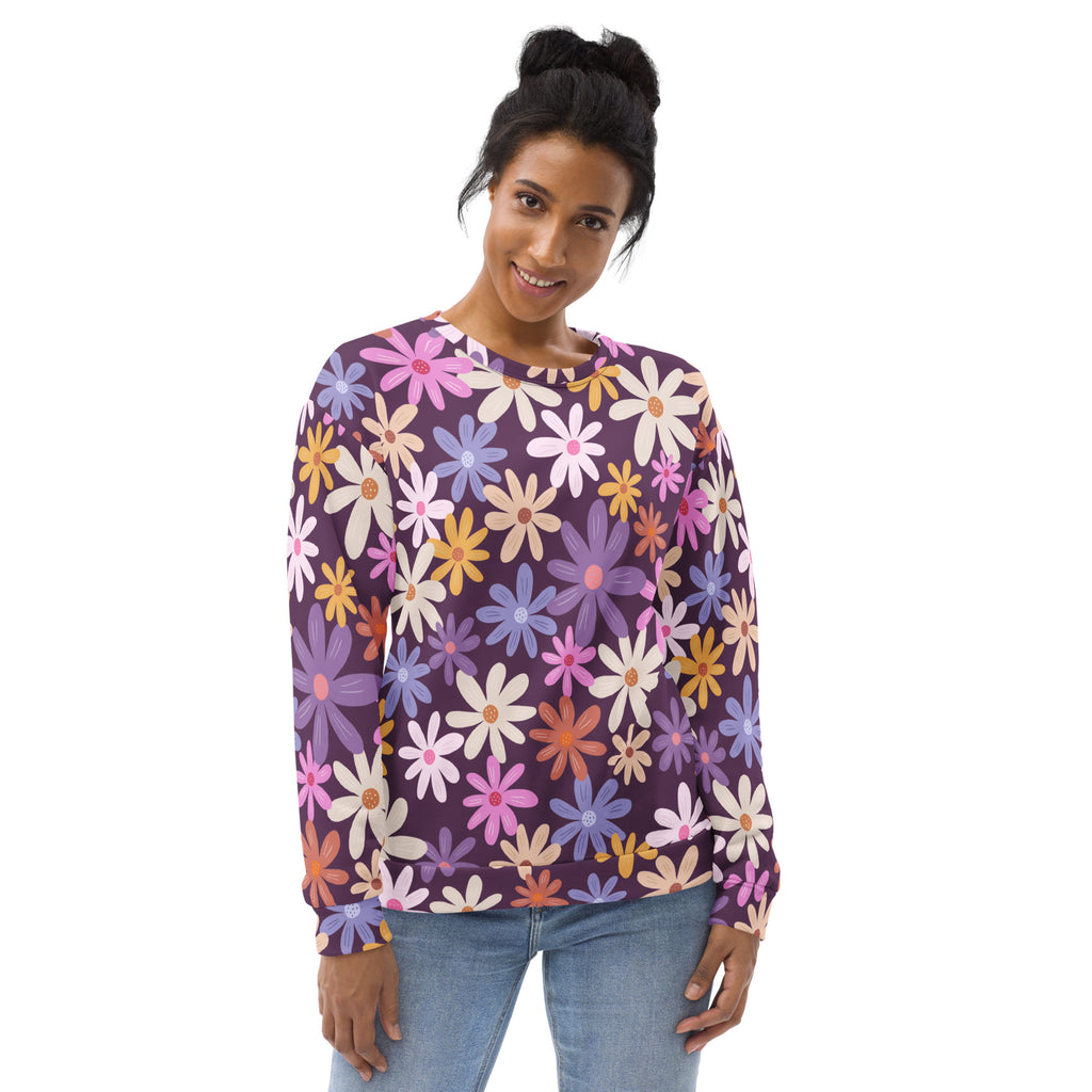 A vibrant purple floral sweatshirt with colorful daisies and brushed inner fleece for warmth and comfort