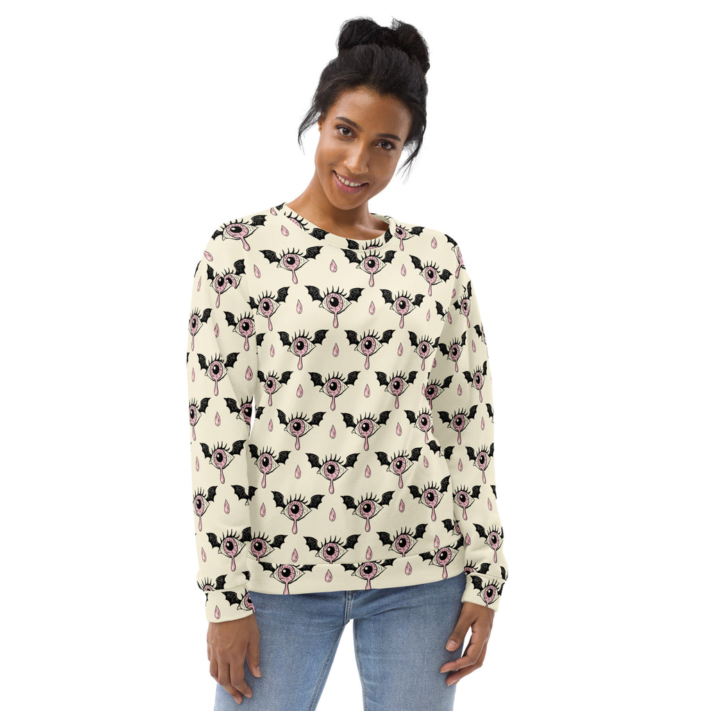Cream-colored gothic eyeball halloween sweatshirt with long sleeves, black bat pattern, pink eyes, and brushed fleece lining