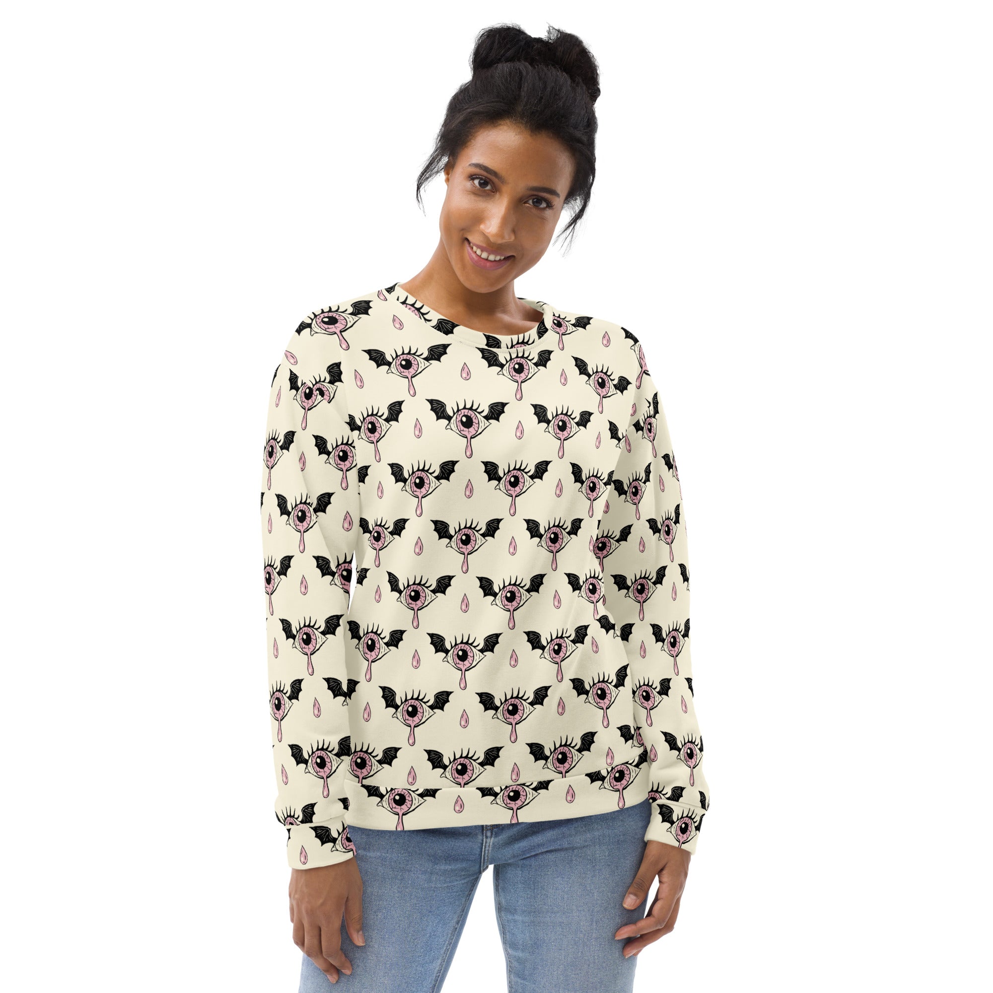 Cream-colored gothic eyeball halloween sweatshirt with long sleeves, black bat pattern, pink eyes, and brushed fleece lining