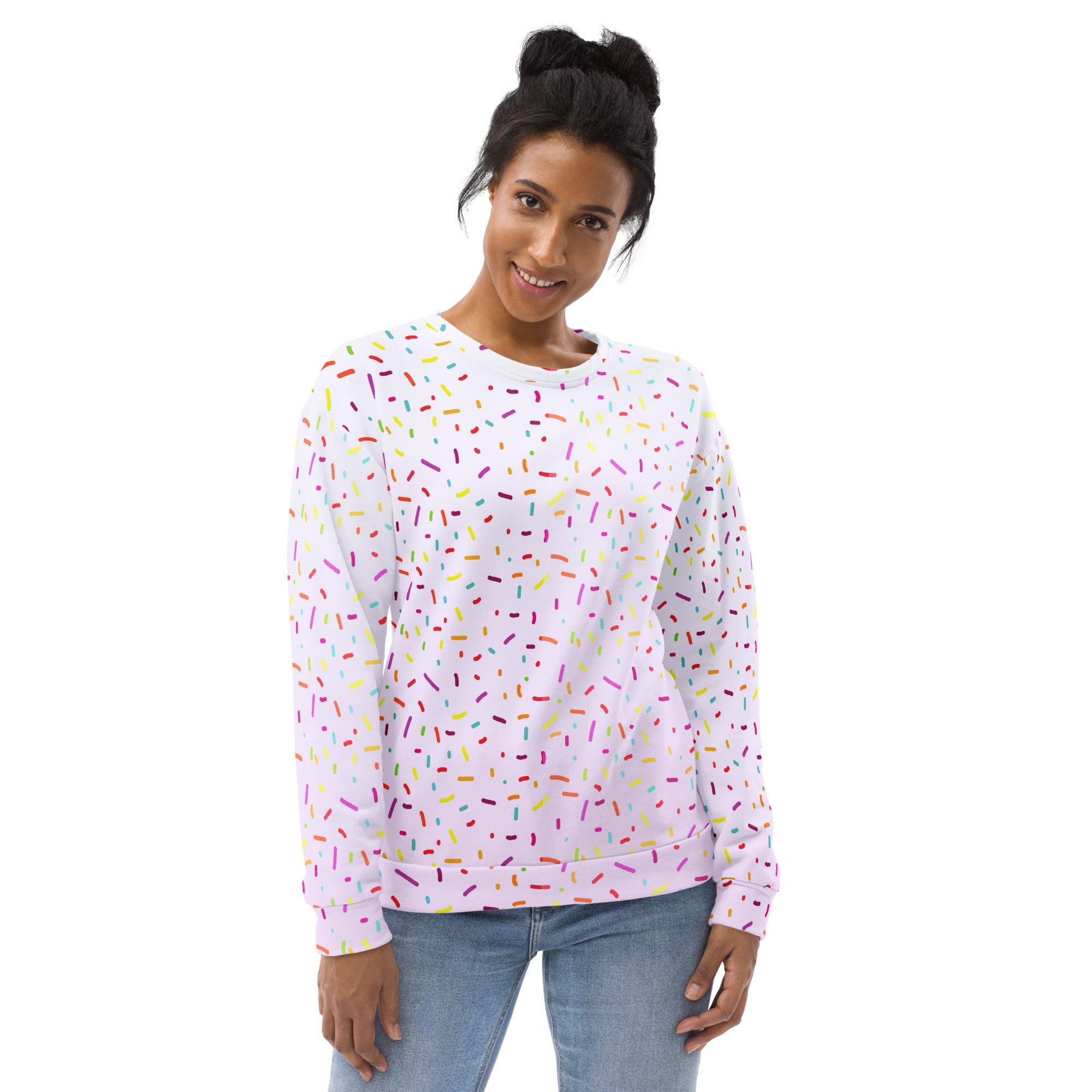 A white long-sleeved sweatshirt with multicolored sprinkles pattern and brushed inner fleece fabric