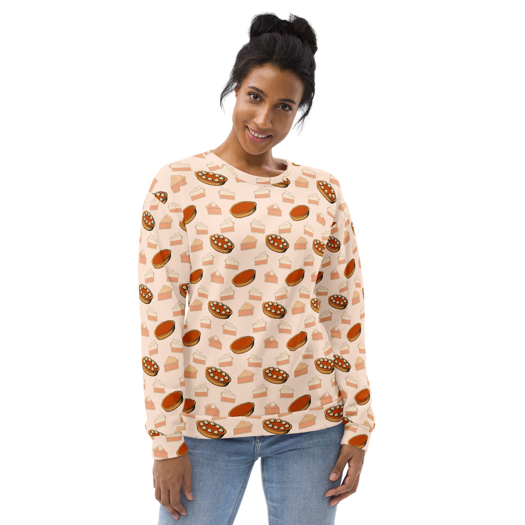 A soft peach-colored pumpkin pie thanksgiving sweatshirt with playful print and brushed inner fleece fabric