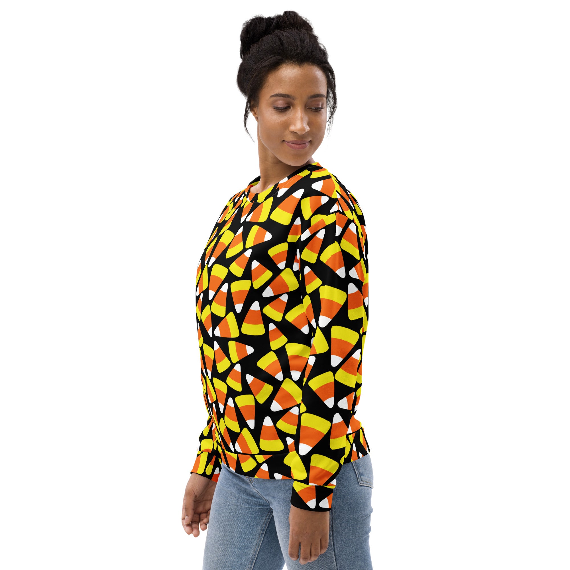 A black long-sleeved candy corn halloween sweatshirt with vibrant pattern and brushed inner fleece fabric