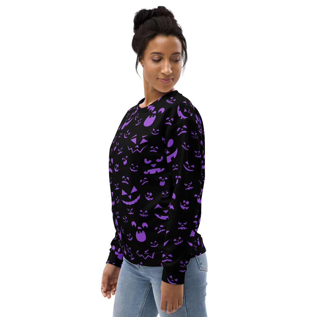 Black long-sleeved sweatshirt with vibrant purple halloween jack-o-lantern and ghost pattern and brushed fleece lining