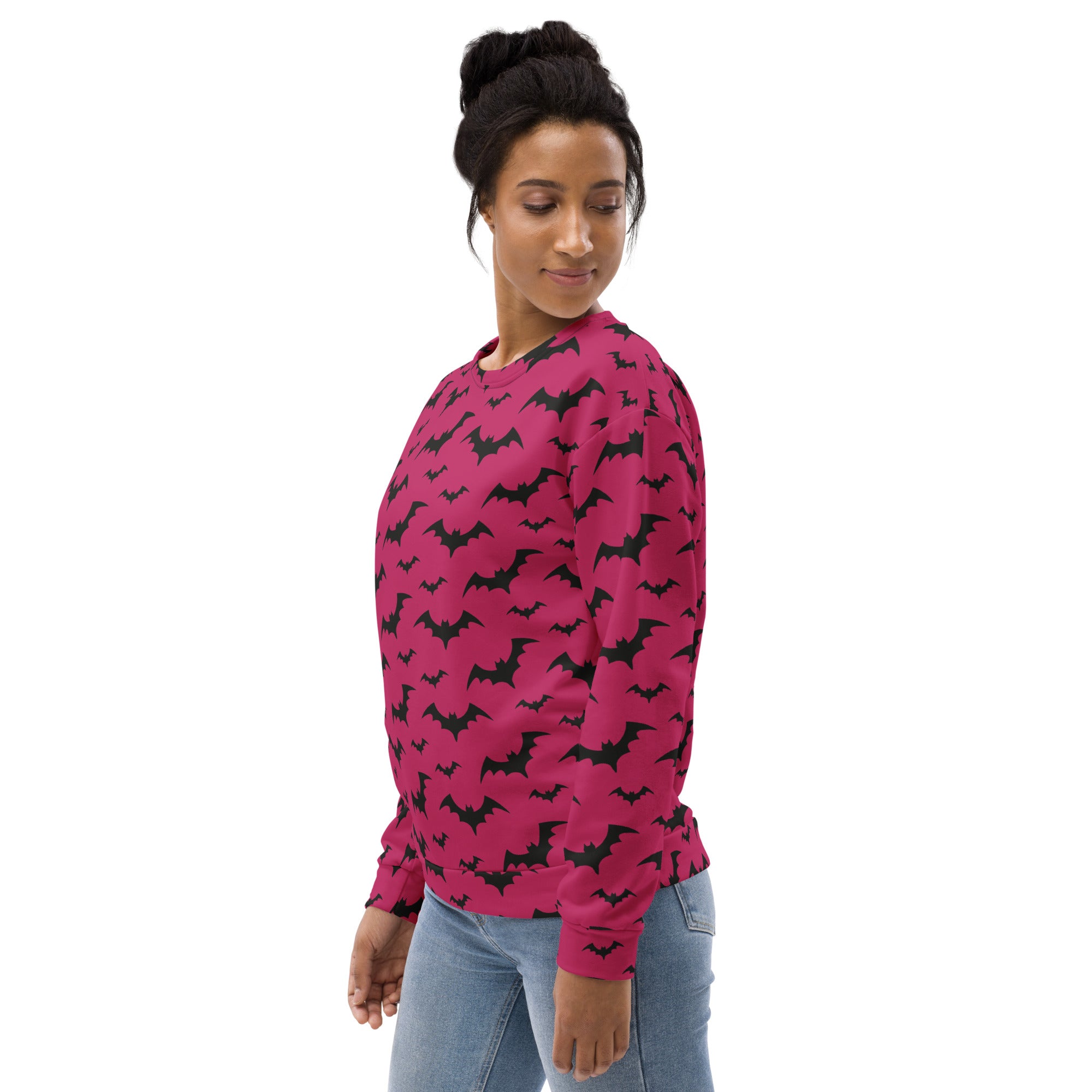 A vibrant magenta long-sleeved sweatshirt with black bat pattern and brushed inner fleece fabric for Halloween