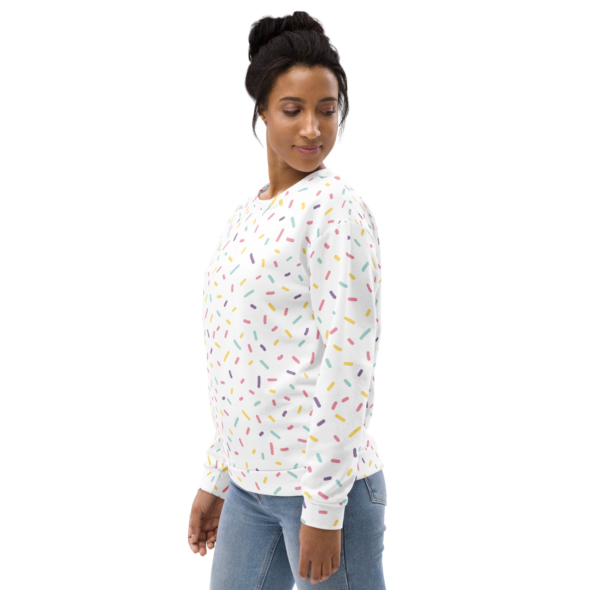 White long-sleeved sweatshirt with colorful sprinkles pattern and brushed inner fleece fabric for cozy wear