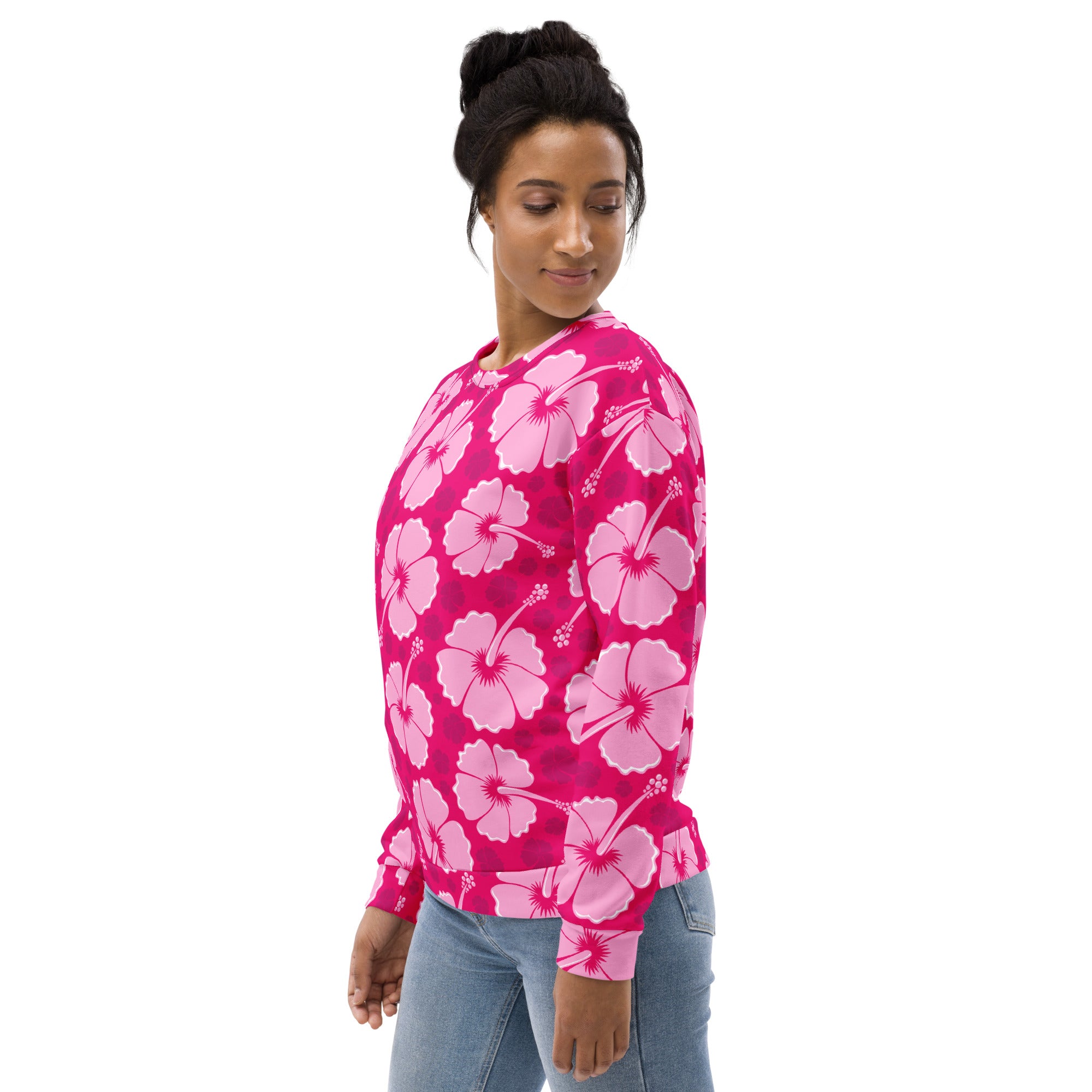 A vibrant pink long-sleeved sweatshirt with lighter pink hibiscus pattern and brushed inner fleece fabric for comfort