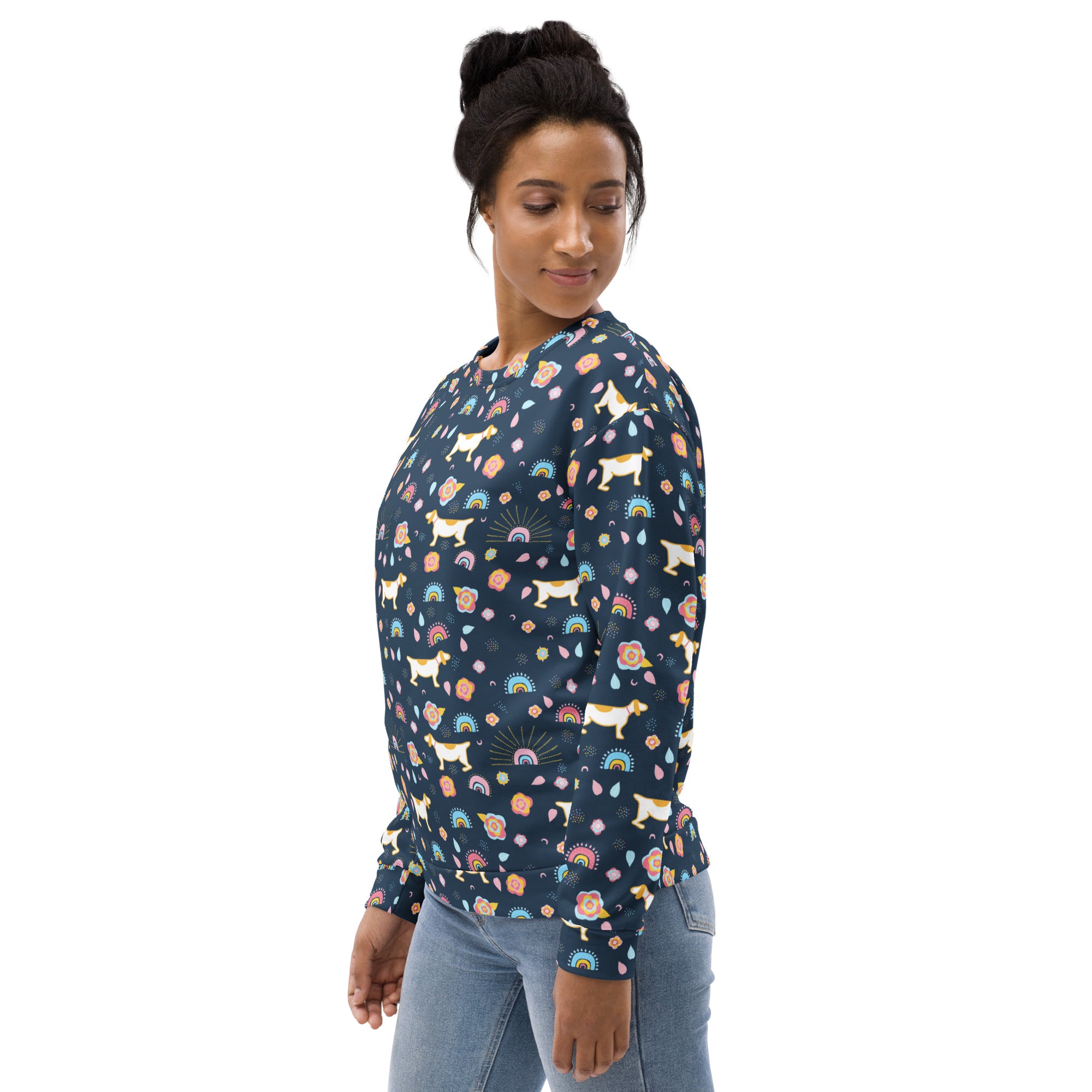 A navy blue long-sleeved sweatshirt with white dogs rainbows pastel flowers and brushed inner fleece fabric