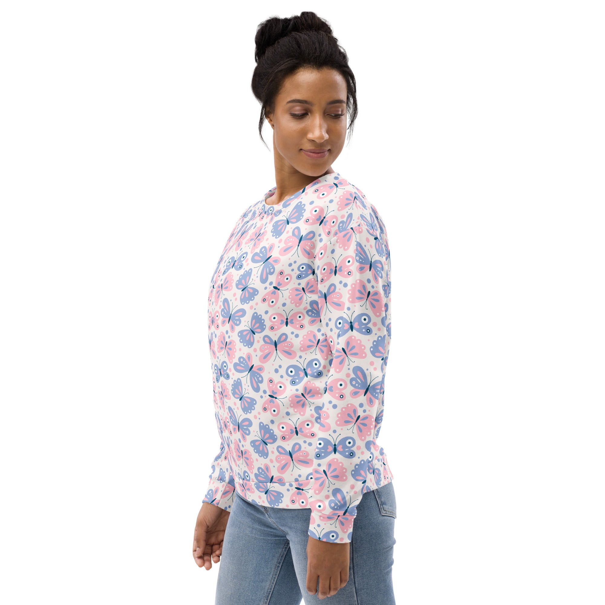 A soft pastel butterfly sweatshirt with long sleeves white base and brushed inner fleece fabric featuring pink and blue butterflies