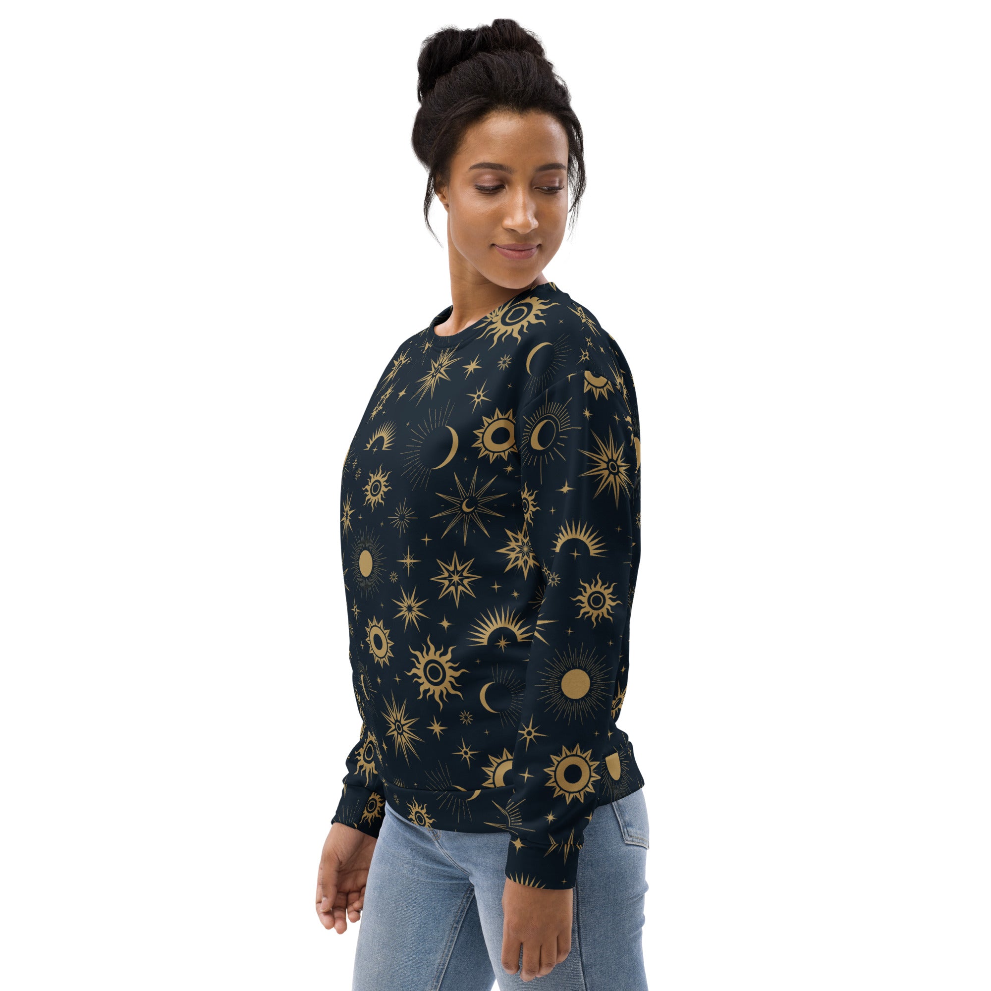 A dark navy celestial sun and moon sweatshirt with vibrant gold pattern and brushed inner fleece fabric