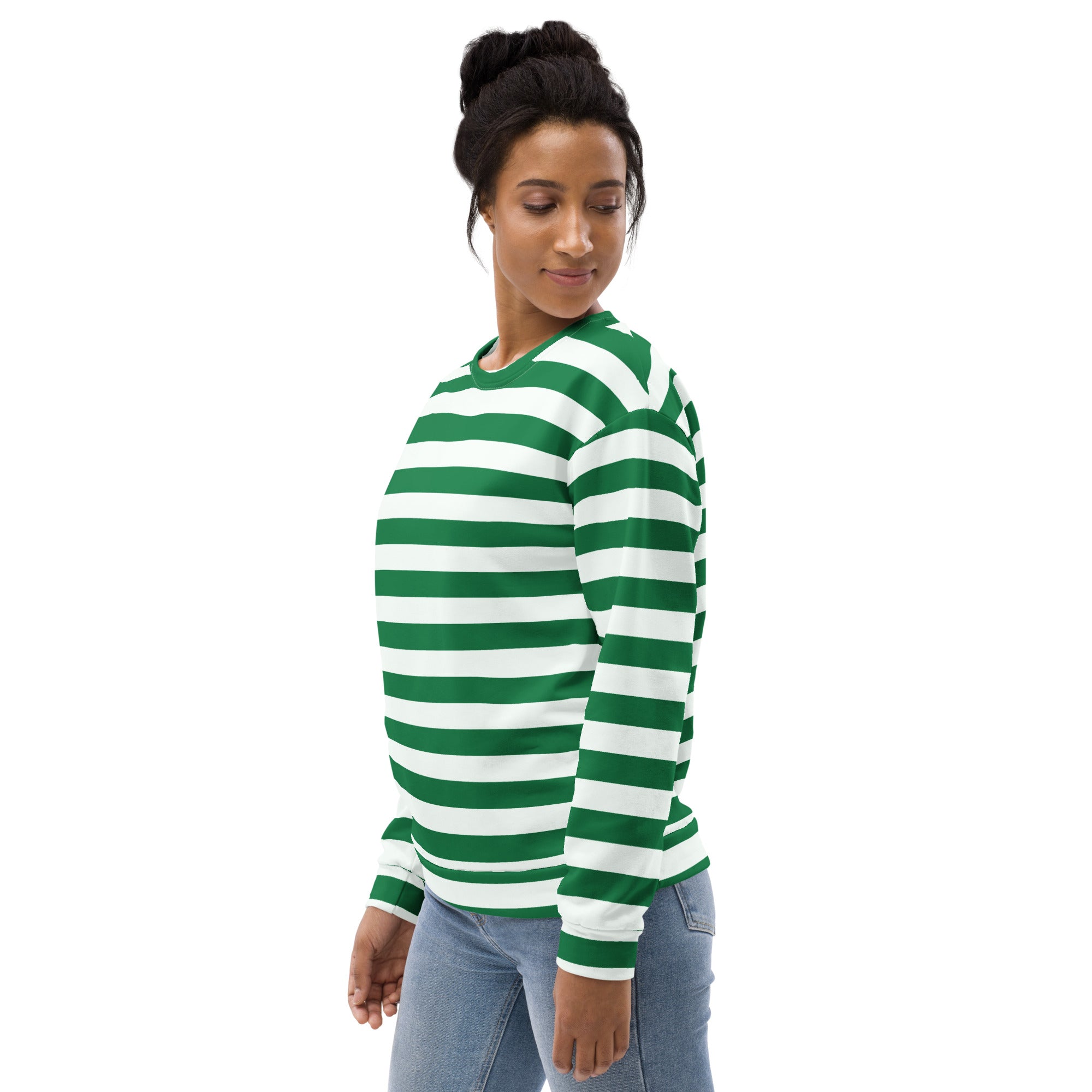A woman wearing a green and white candy cane striped Christmas sweatshirt with brushed inner fleece fabric