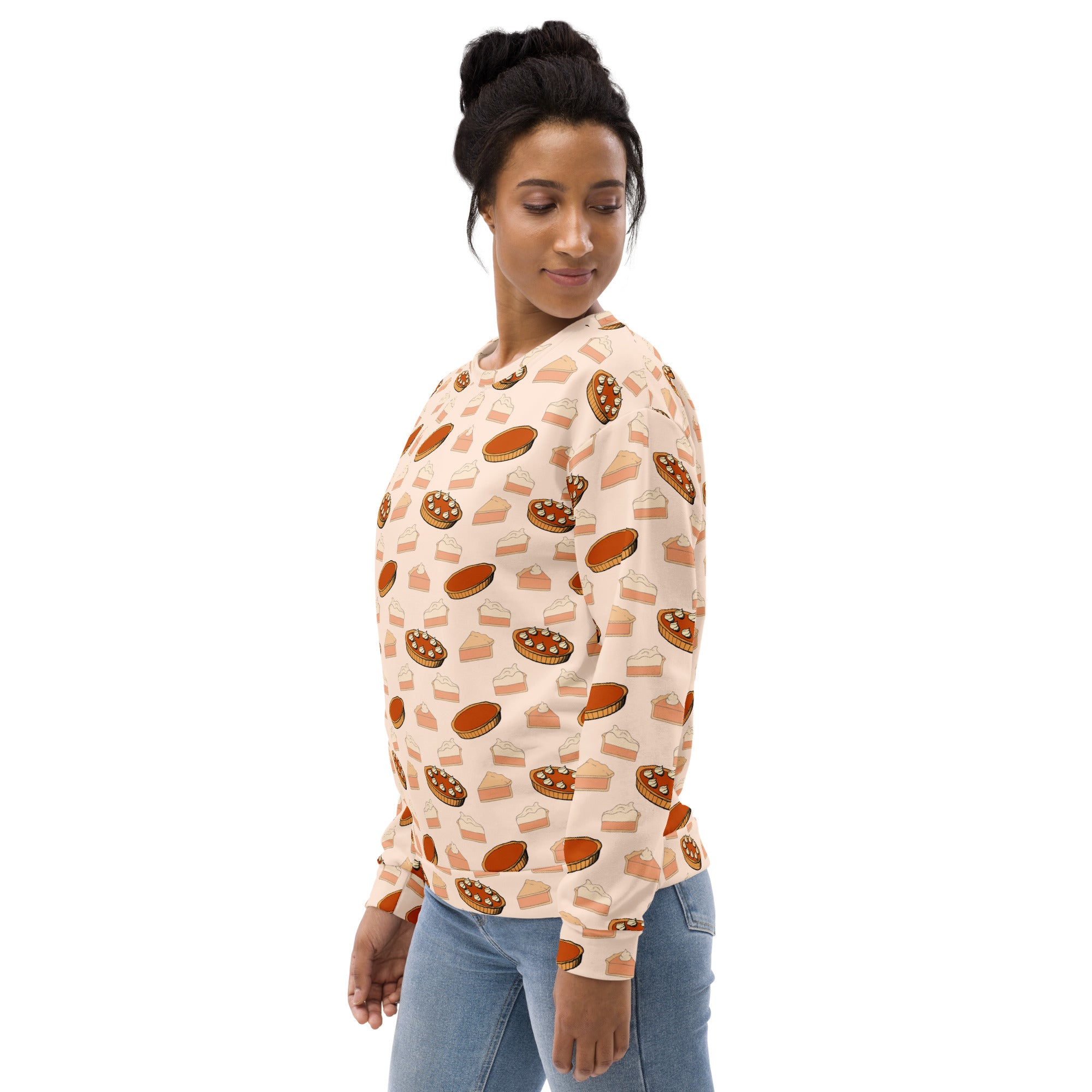 A soft peach-colored pumpkin pie thanksgiving sweatshirt with playful pie prints and brushed inner fleece fabric
