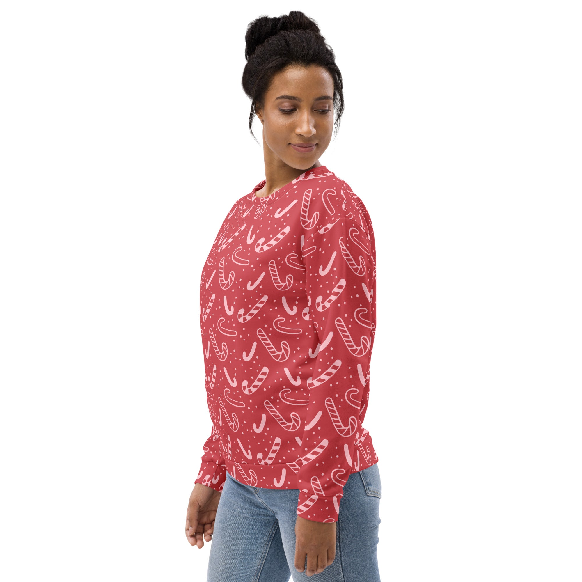 Red candy cane Christmas sweatshirt with white patterns and brushed inner fleece fabric for winter warmth