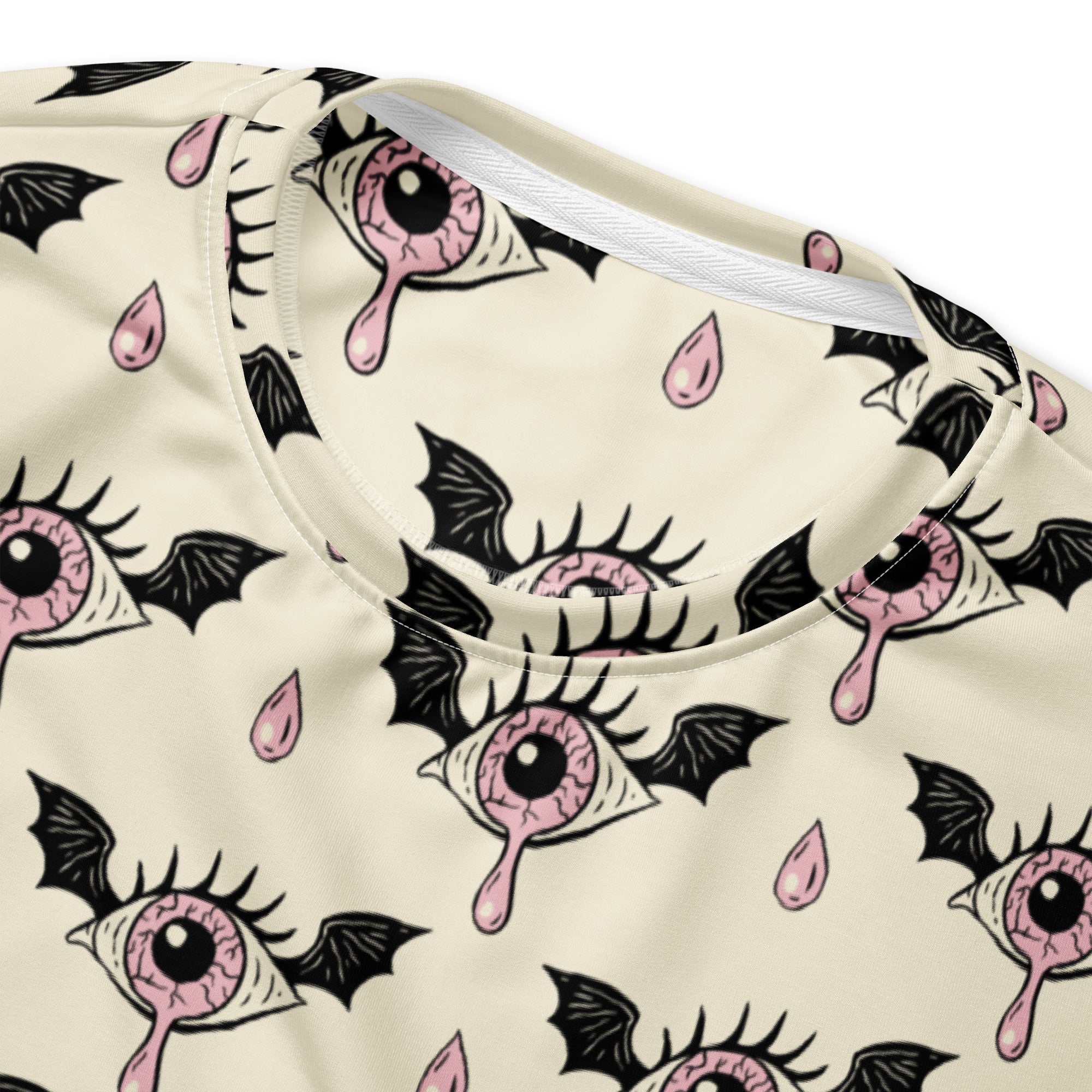 Cream-colored gothic eyeball Halloween sweatshirt with pink dripping eyes pattern and brushed inner fleece fabric