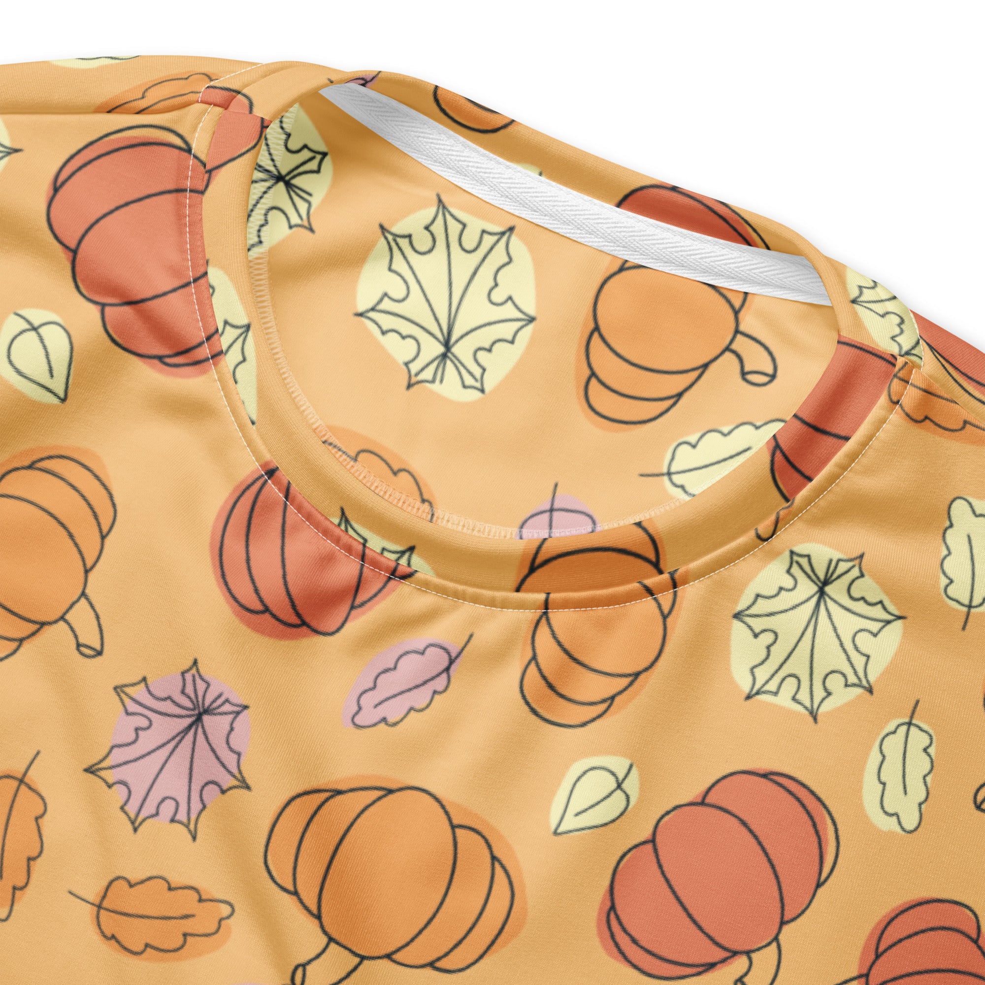 Orange pumpkin and leaf patterned sweatshirt with white ribbed collar and brushed inner fleece fabric