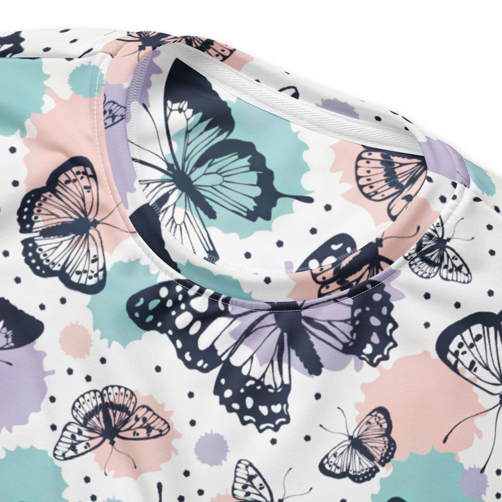 A soft white butterfly sweatshirt with black outlines and pastel pink and mint splotches featuring brushed fleece