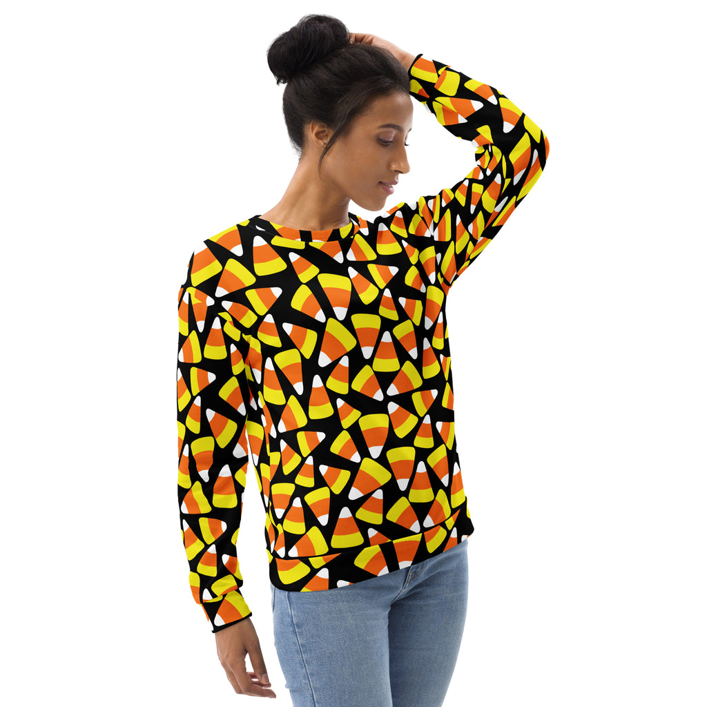A black long-sleeved candy corn halloween sweatshirt with vibrant orange yellow white pattern and brushed fleece lining