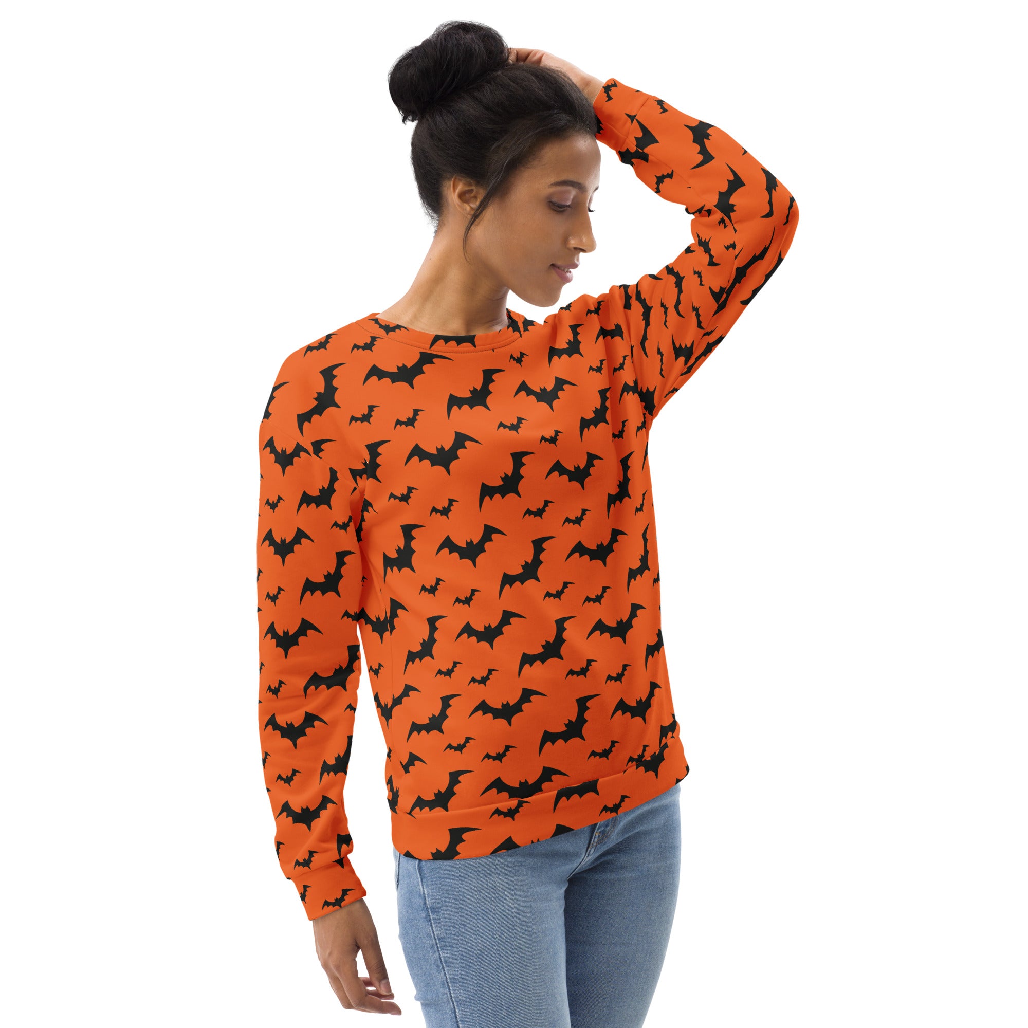Orange long sleeved sweatshirt with black bat pattern and brushed inner fleece fabric for halloween wear