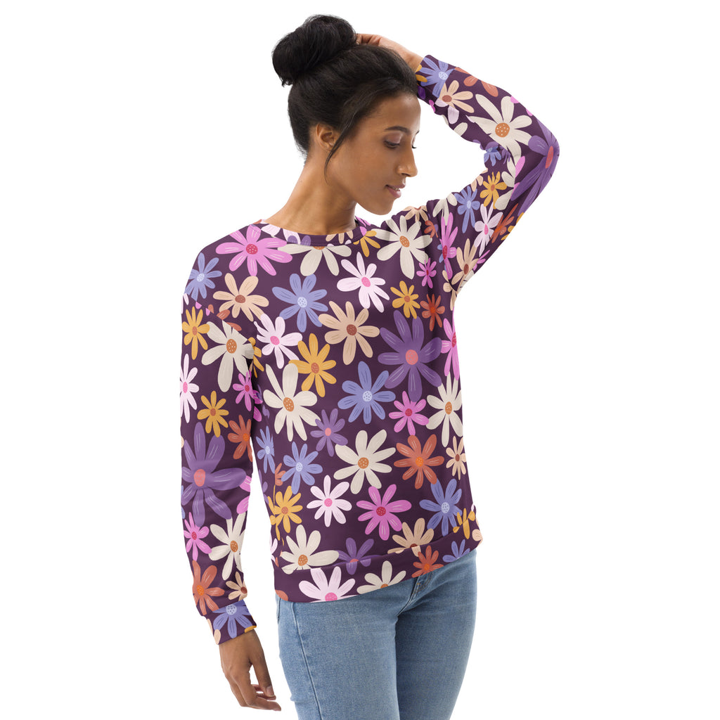 Purple long-sleeved sweatshirt with vibrant multicolored floral daisies and brushed inner fleece fabric for warmth