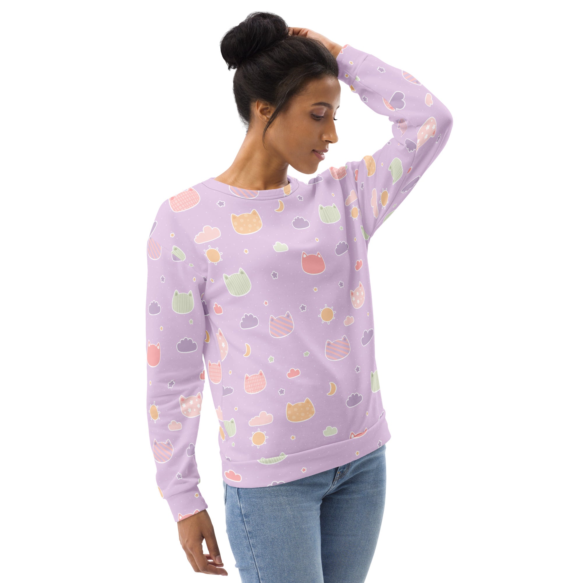 A soft lavender long-sleeved sweatshirt with pastel kawaii cats clouds and moons and brushed inner fleece fabric