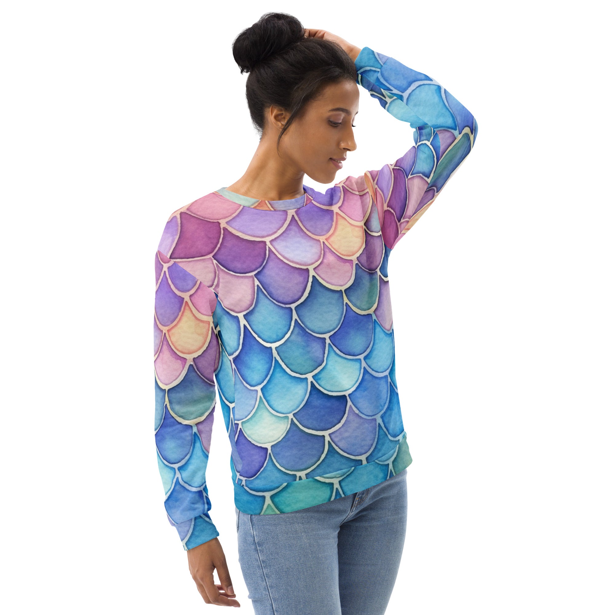 A colorful long-sleeved sweatshirt with gradient mermaid scales in blue purple and pink and brushed fleece fabric