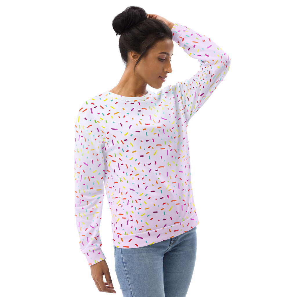 A white long-sleeved sweatshirt with multicolored sprinkles and brushed inner fleece fabric for cozy wear