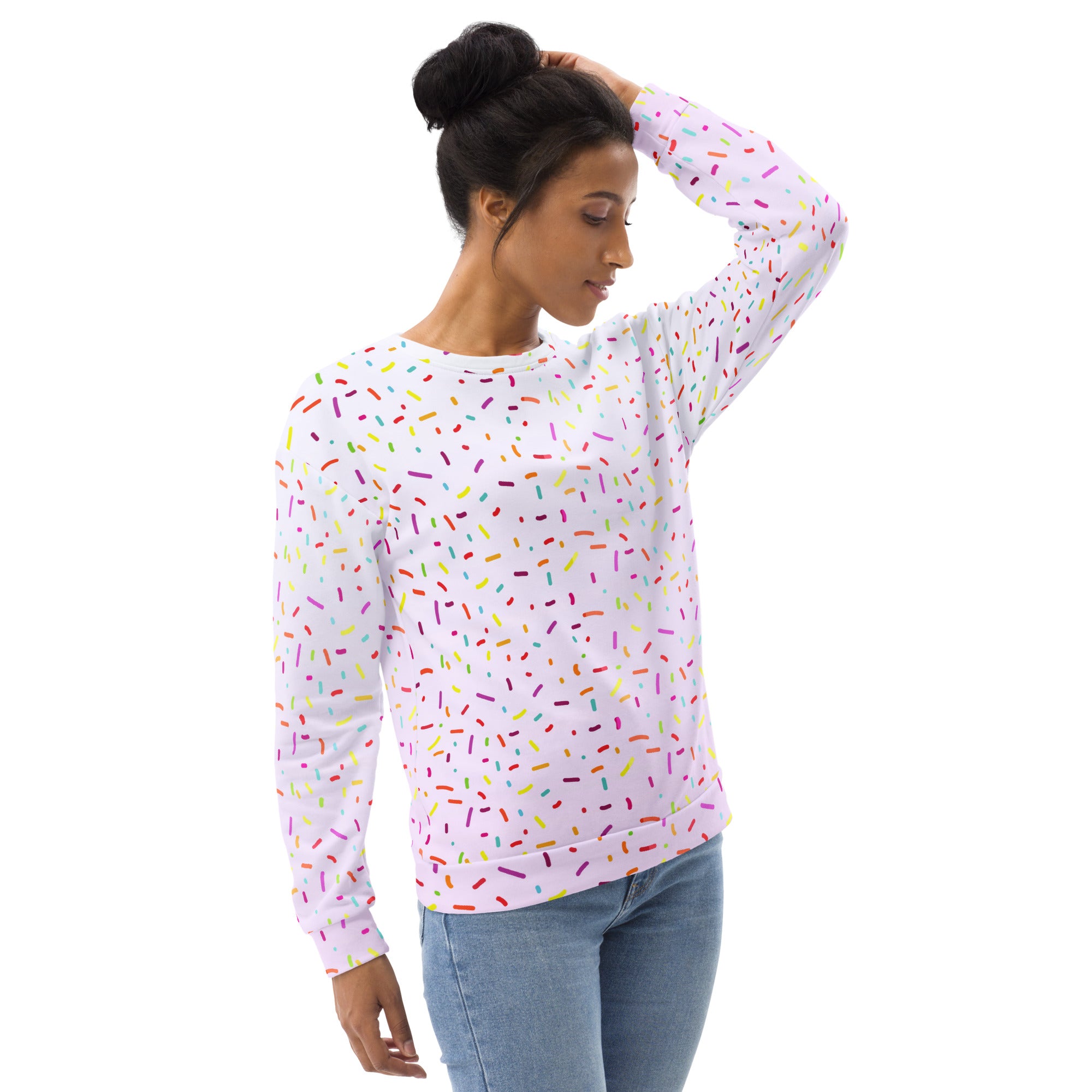 A white long-sleeved sweatshirt with multicolored sprinkles and brushed inner fleece fabric for cozy wear
